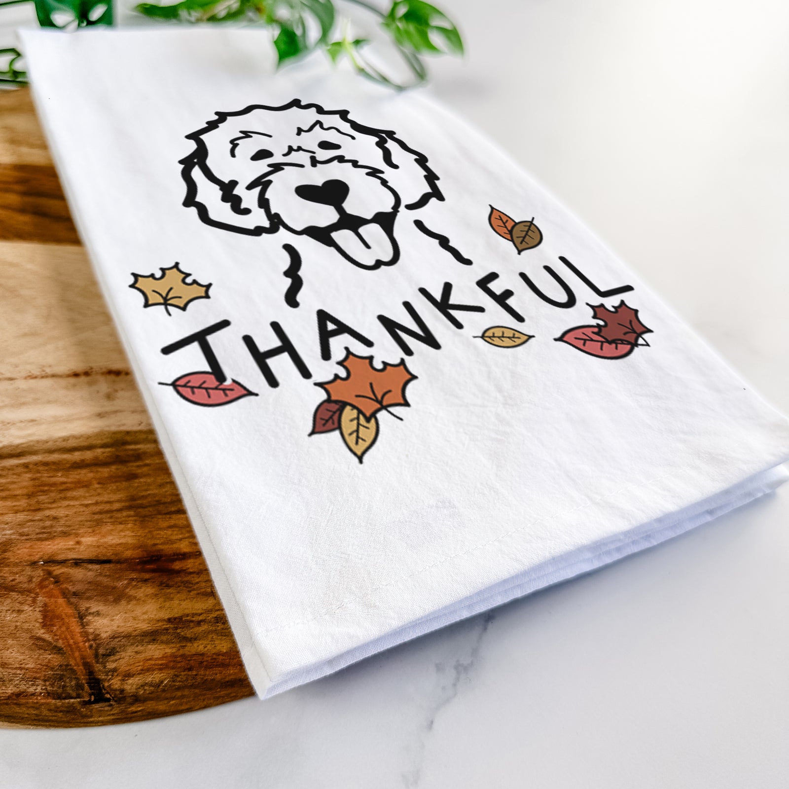 Minimalist line drawing of a Labradoodle with 'Thankful' lettering on a tea towel