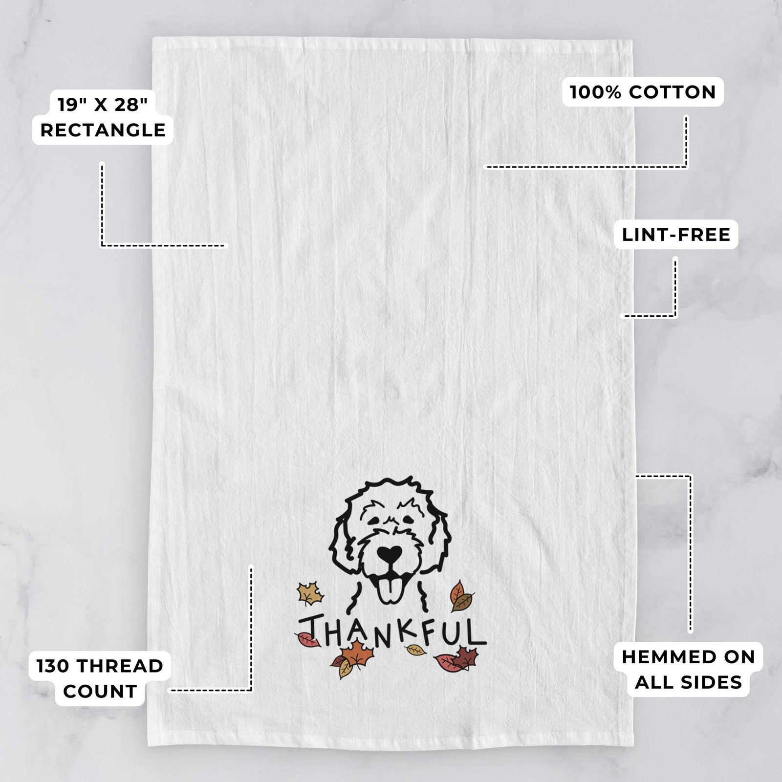 Minimalist line drawing of a Labradoodle with 'Thankful' lettering on a tea towel, with feature callouts: 19 x 28 inch rectangle, 100% cotton, lint-free, 120 thread count, hemmed on all sides