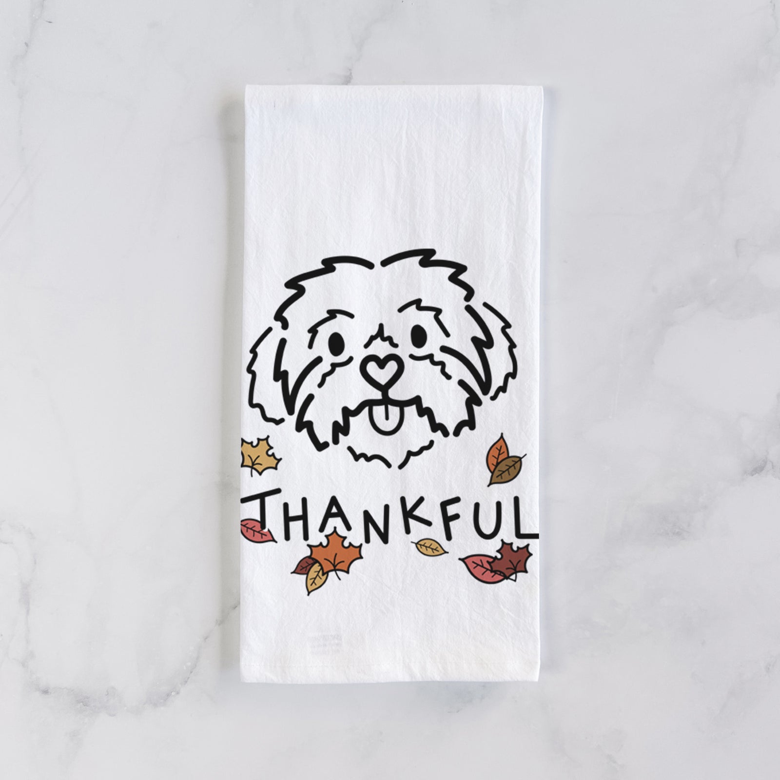 Minimalist line drawing of Leo the Shih Tzu with 'Thankful' lettering on a tea towel