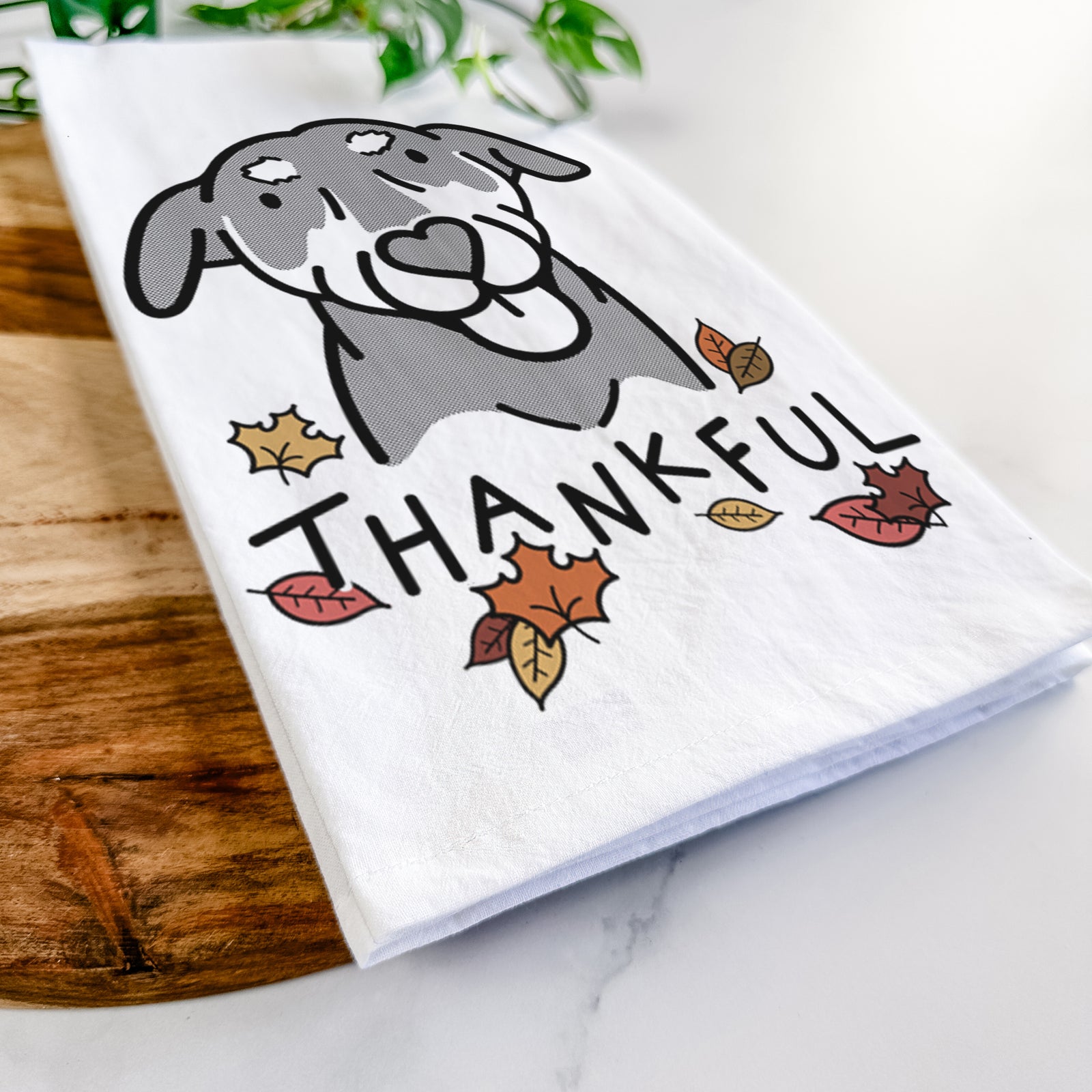 Minimalist line drawing of Lousia the Mixed Breed with 'Thankful' lettering on a tea towel
