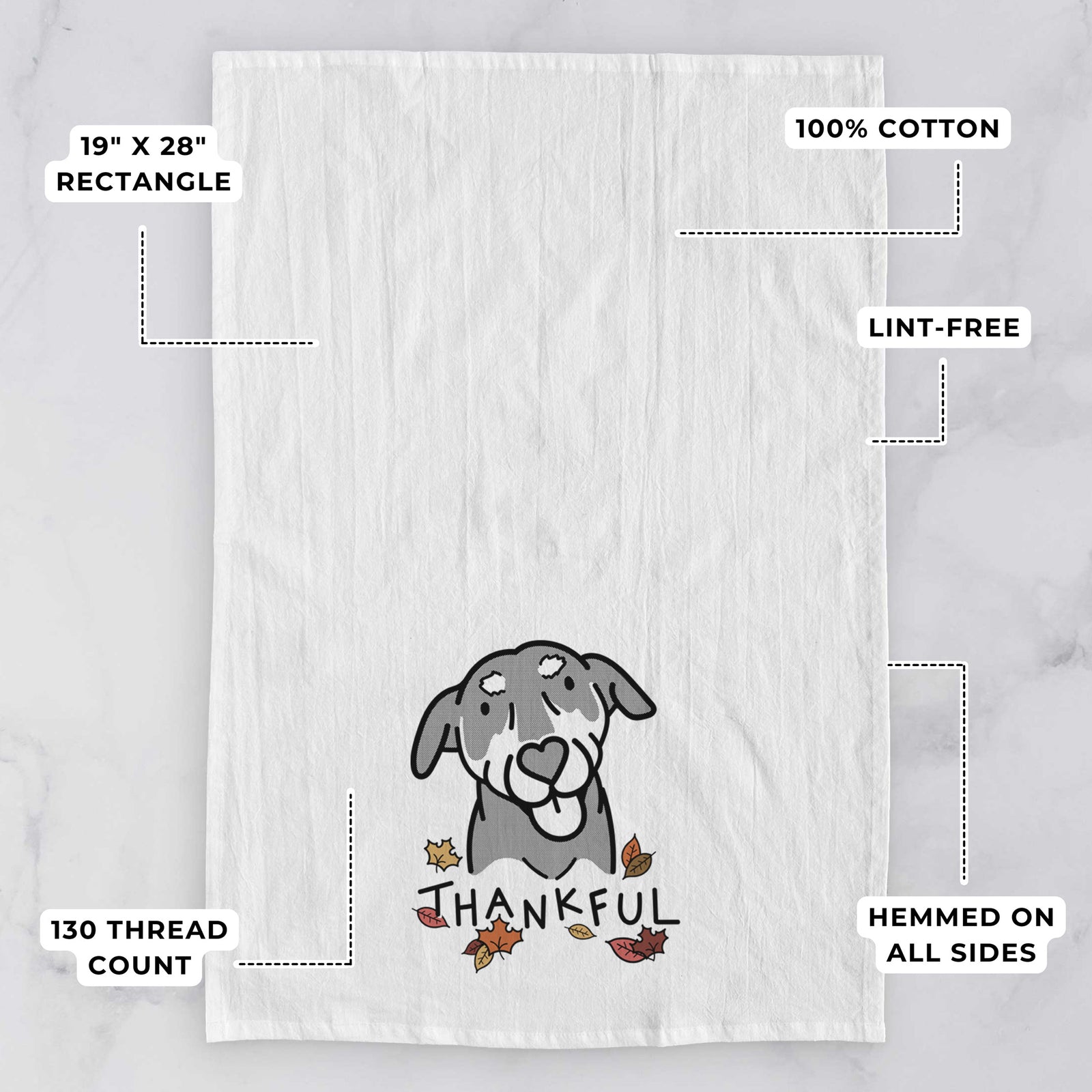 Minimalist line drawing of Lousia the Mixed Breed with 'Thankful' lettering on a tea towel, with feature callouts: 19 x 28 inch rectangle, 100% cotton, lint-free, 120 thread count, hemmed on all sides