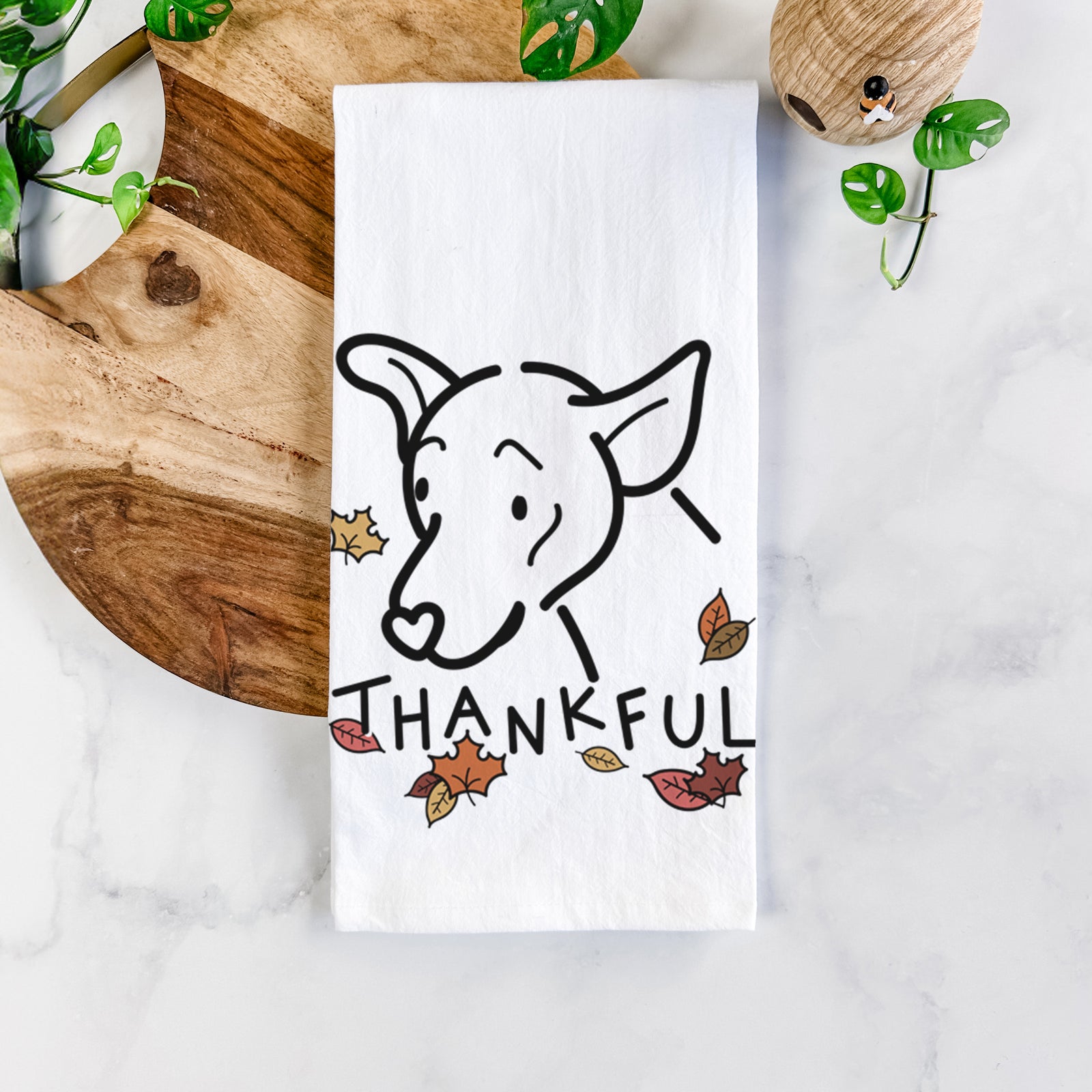 Minimalist line drawing of Lucky the Mixed Breed with 'Thankful' lettering on a tea towel