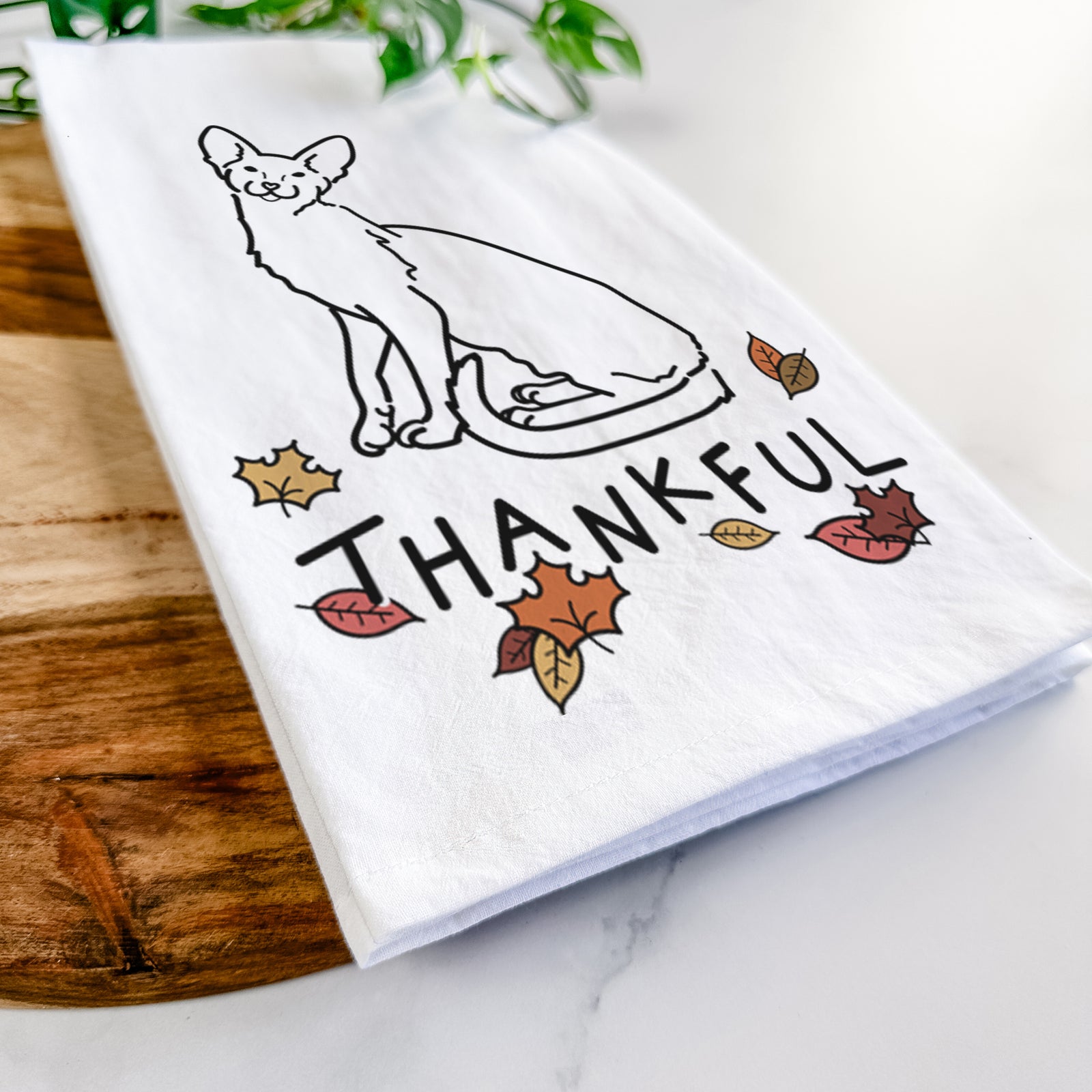 Minimalist line drawing of Lyra the Oriental Shorthair Cat with 'Thankful' lettering on a tea towel