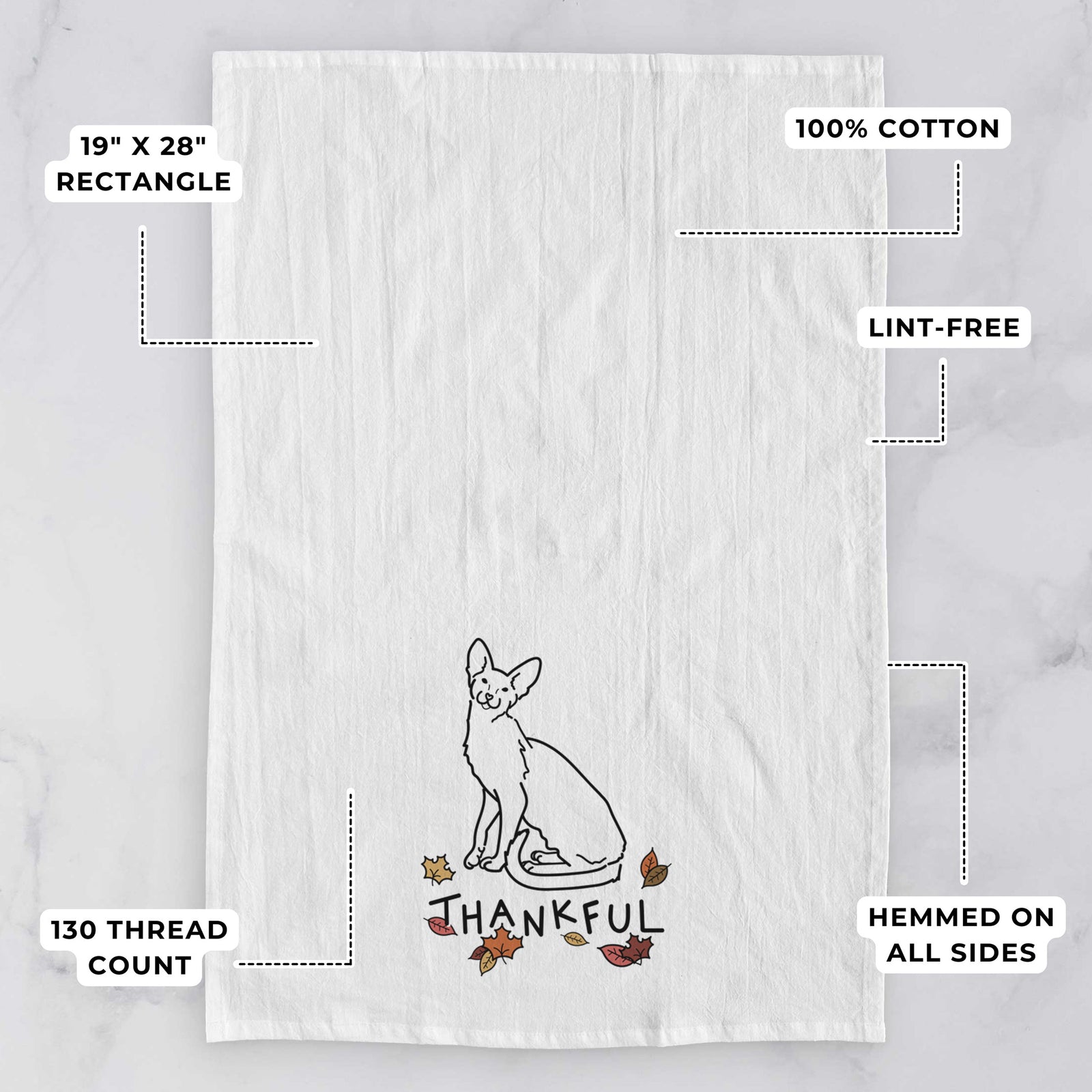 Minimalist line drawing of Lyra the Oriental Shorthair Cat with 'Thankful' lettering on a tea towel, with feature callouts: 19 x 28 inch rectangle, 100% cotton, lint-free, 120 thread count, hemmed on all sides