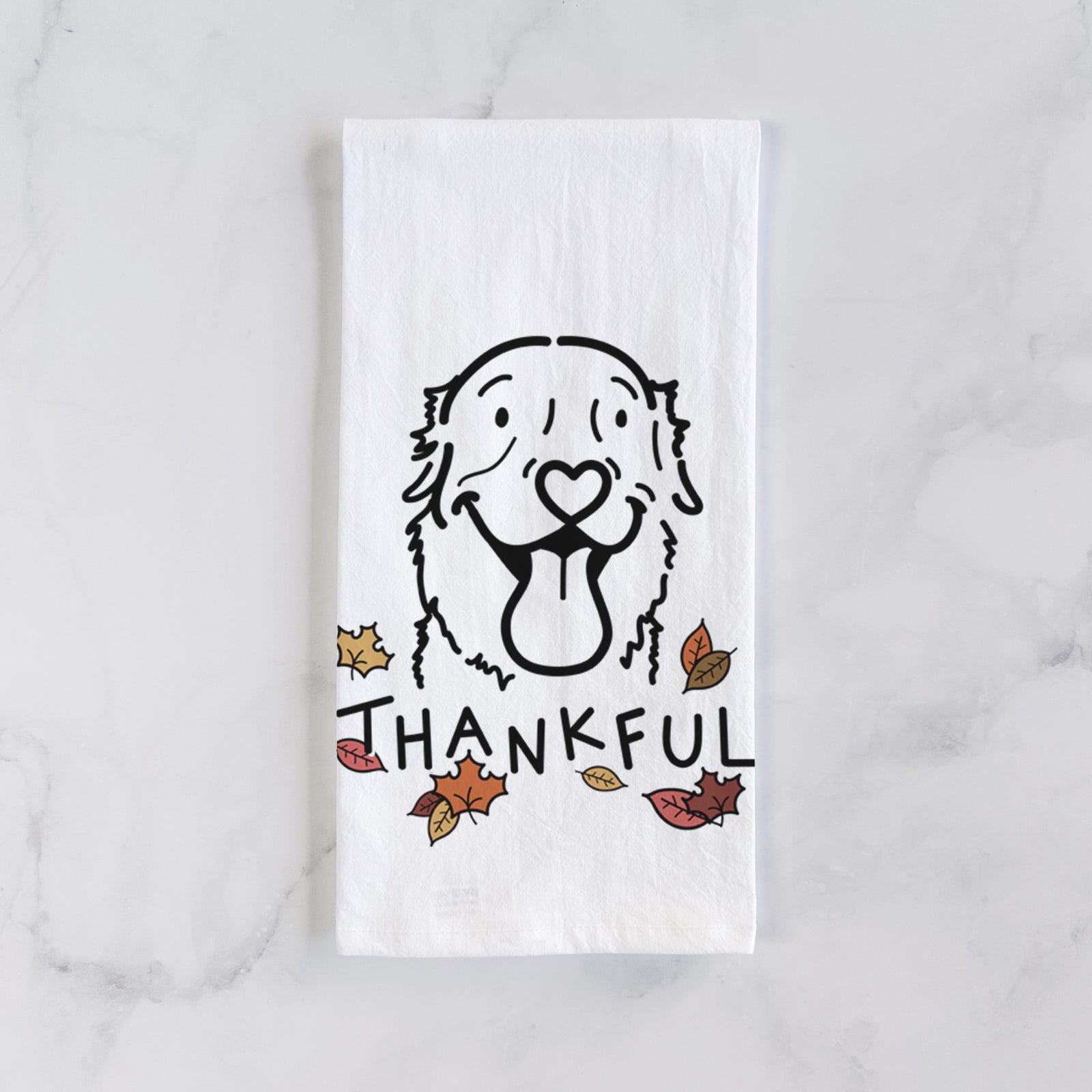Minimalist line drawing of Maple the Golden Retriever with 'Thankful' lettering on a tea towel