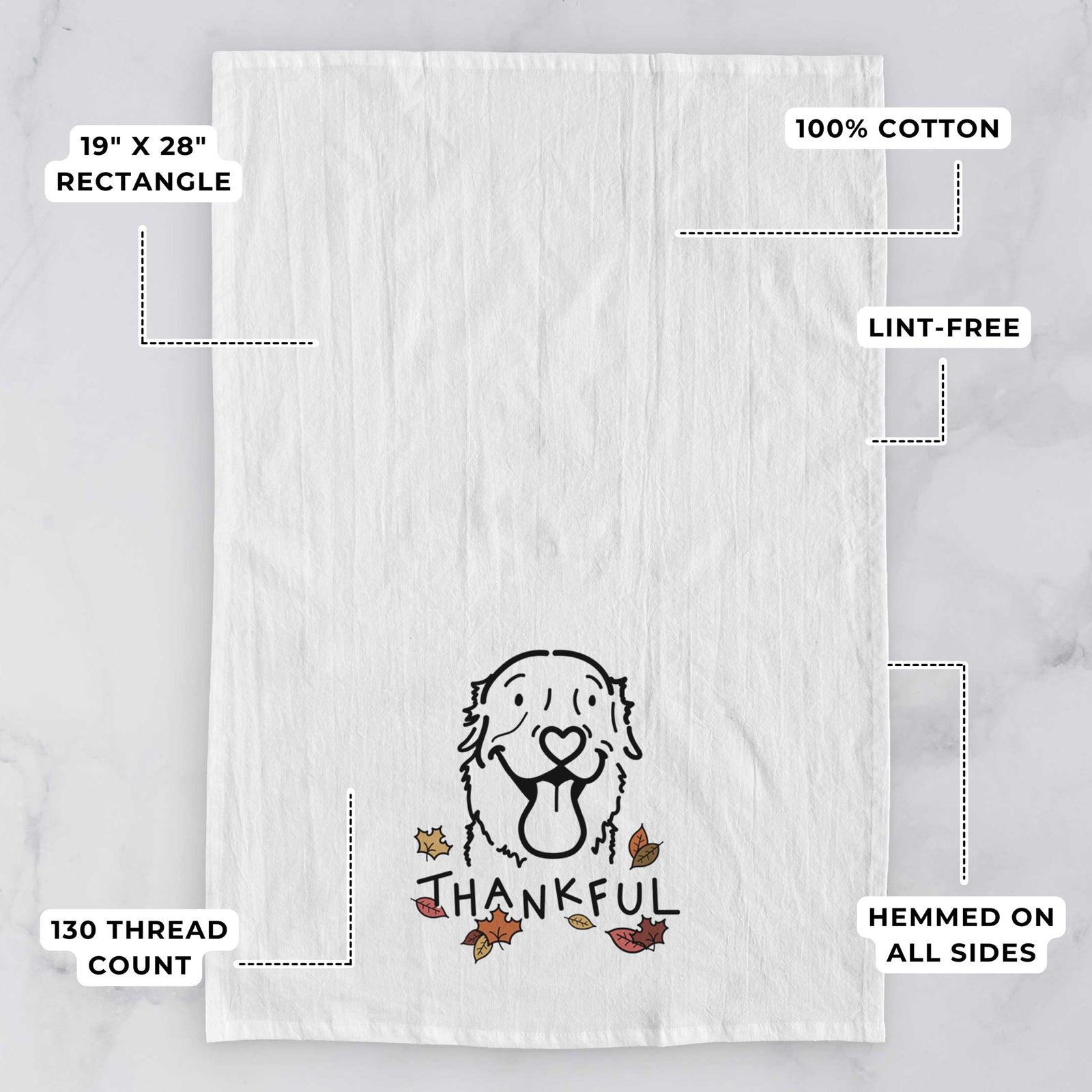 Minimalist line drawing of Maple the Golden Retriever with 'Thankful' lettering on a tea towel, with feature callouts: 19 x 28 inch rectangle, 100% cotton, lint-free, 120 thread count, hemmed on all sides