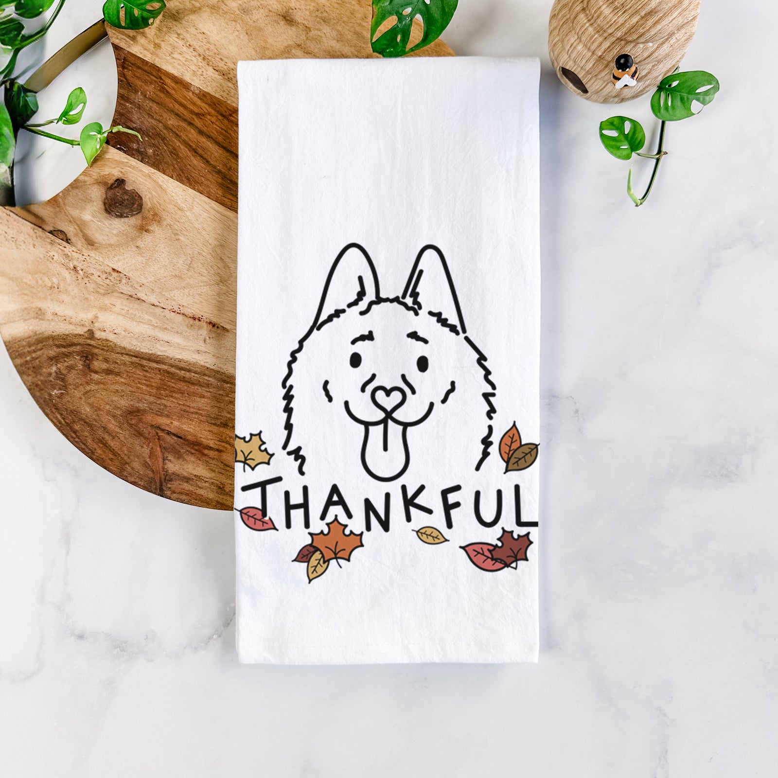 Minimalist line drawing of Meeko the Schipperke with 'Thankful' lettering on a tea towel