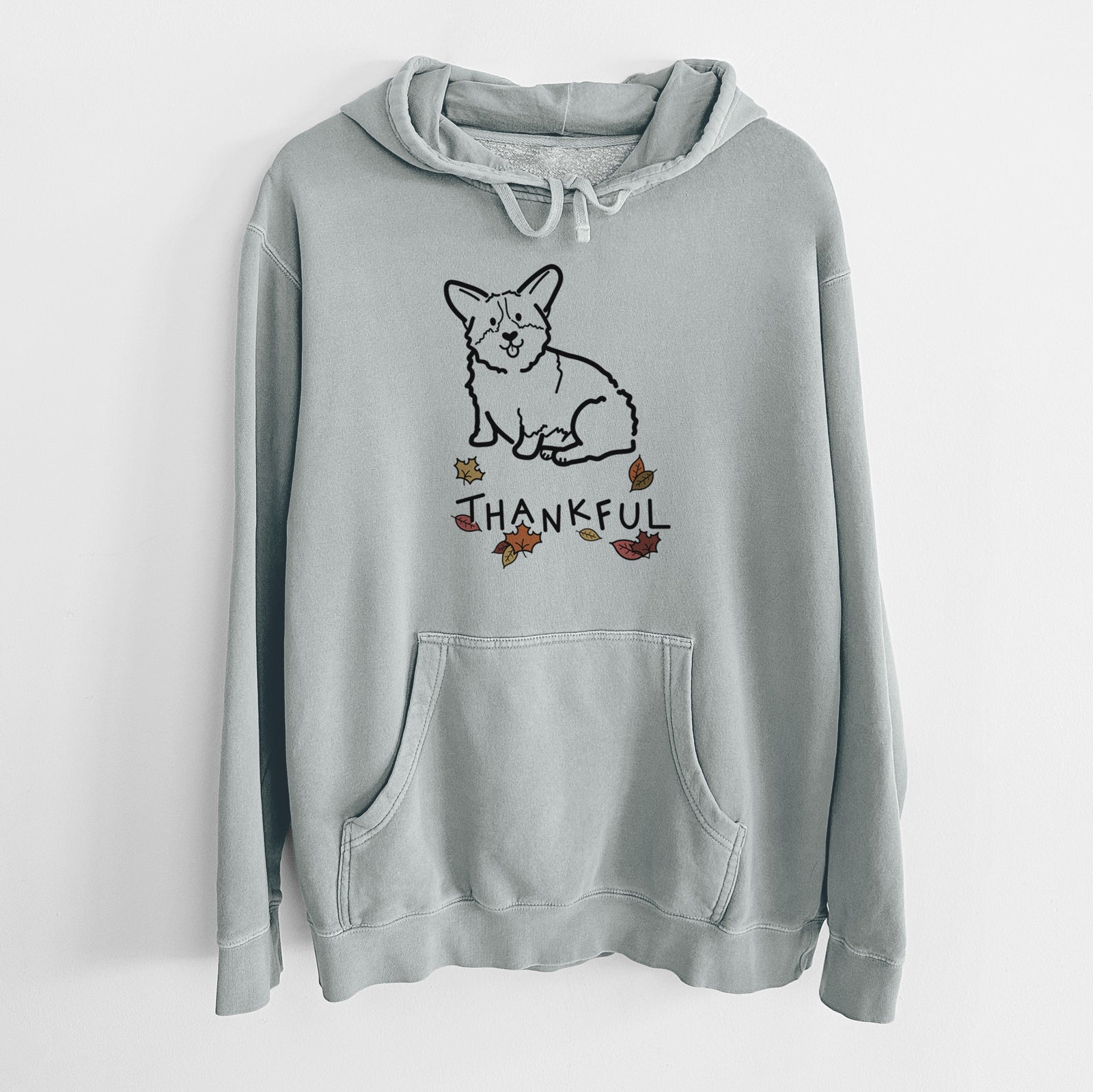 Minimalist line drawing of Millie the Pembroke Welsh Corgi with 'Thankful' lettering on a Sage Unisex pigment dyed hoodie