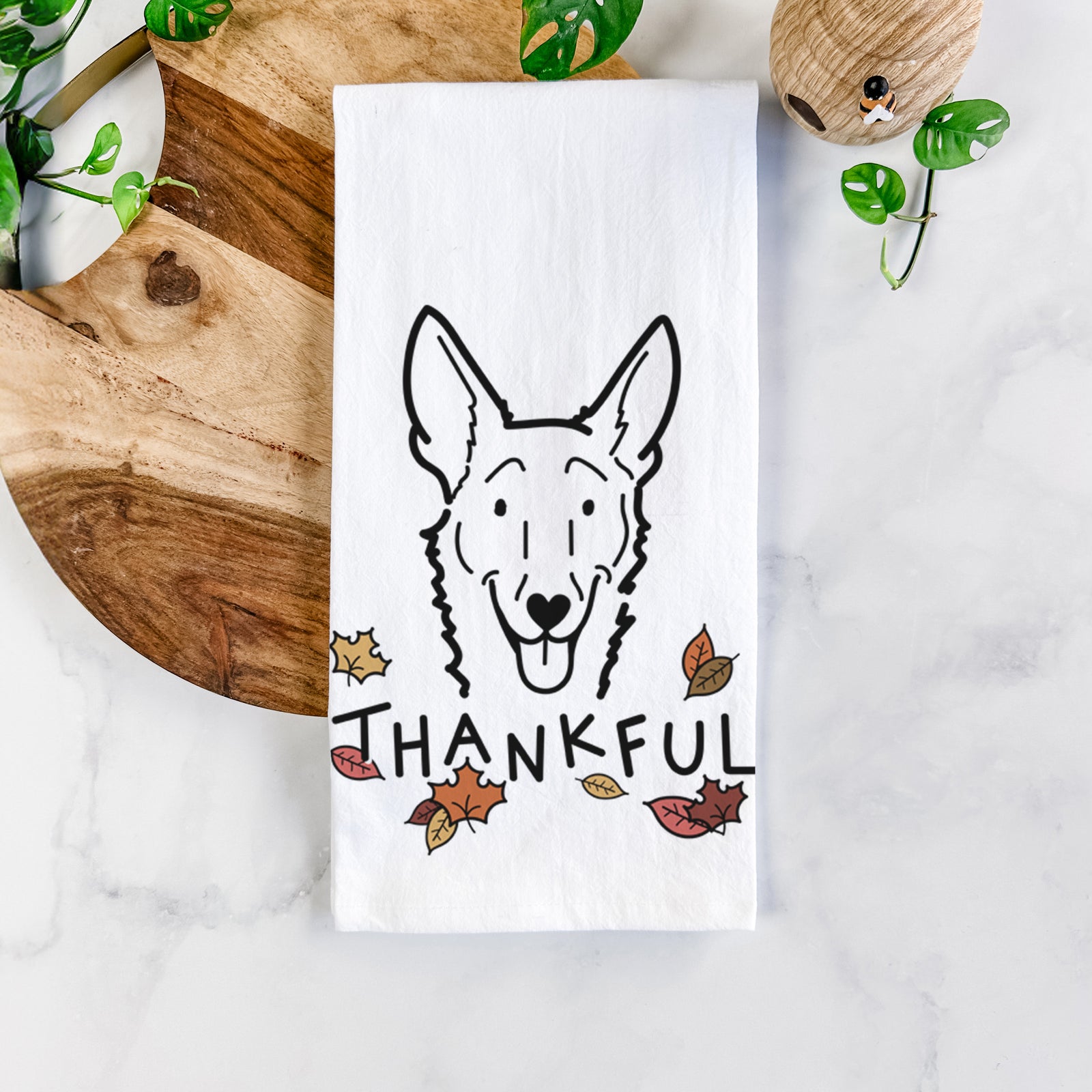 Minimalist line drawing of Mochi the Carolina Dog with 'Thankful' lettering on a tea towel