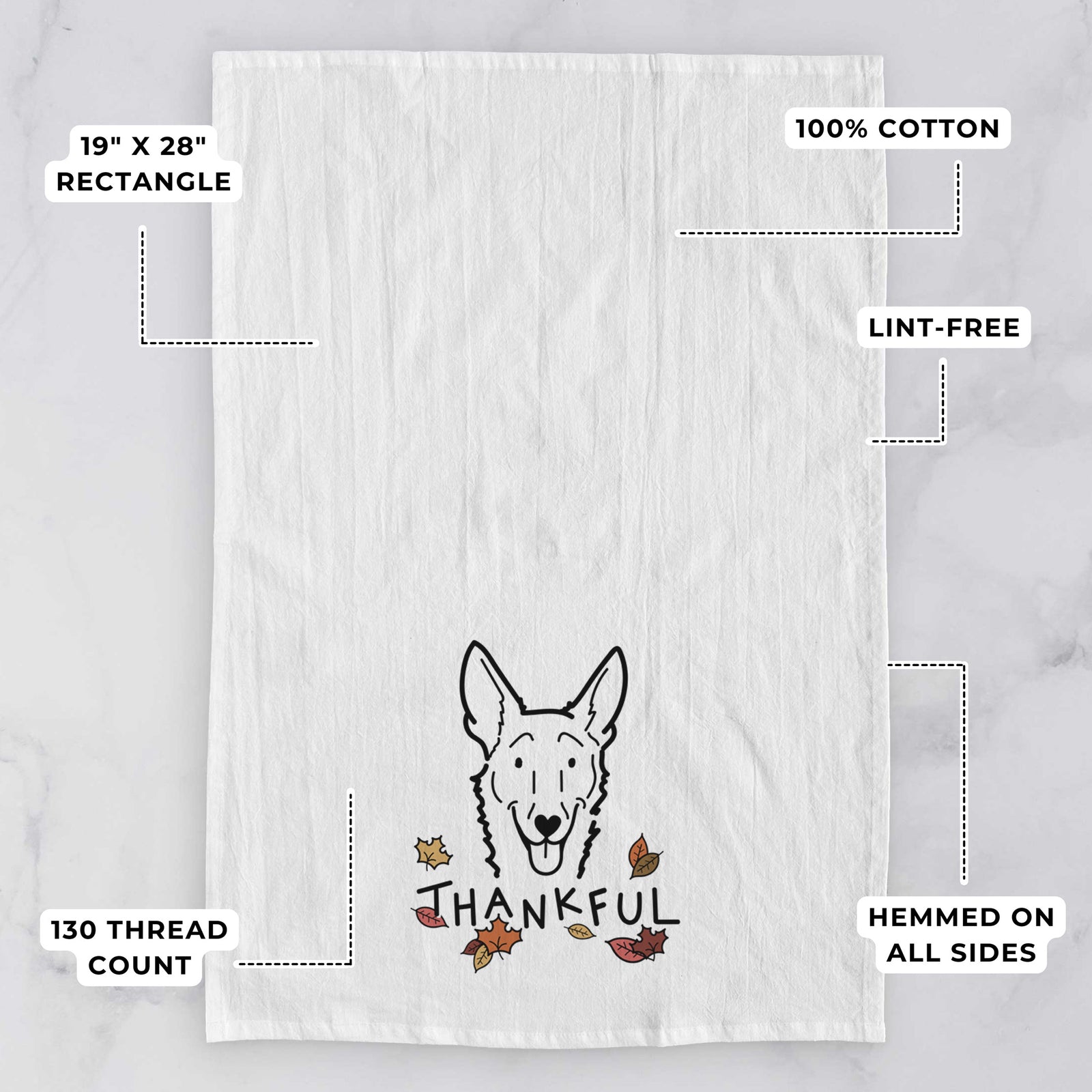 Minimalist line drawing of Mochi the Carolina Dog with 'Thankful' lettering on a tea towel, with feature callouts: 19 x 28 inch rectangle, 100% cotton, lint-free, 120 thread count, hemmed on all sides
