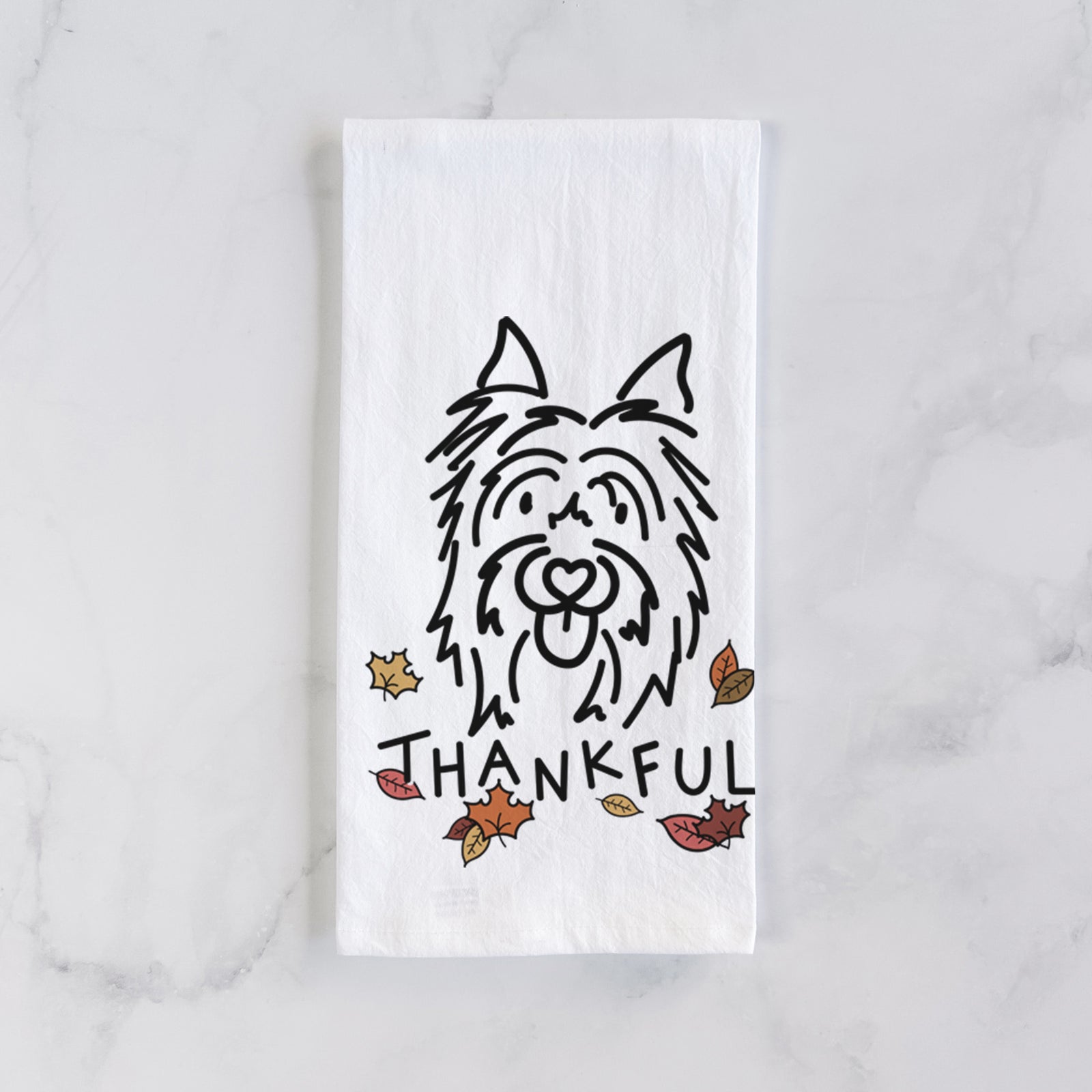 Minimalist line drawing of Monty the Silky Terrier with 'Thankful' lettering on a tea towel