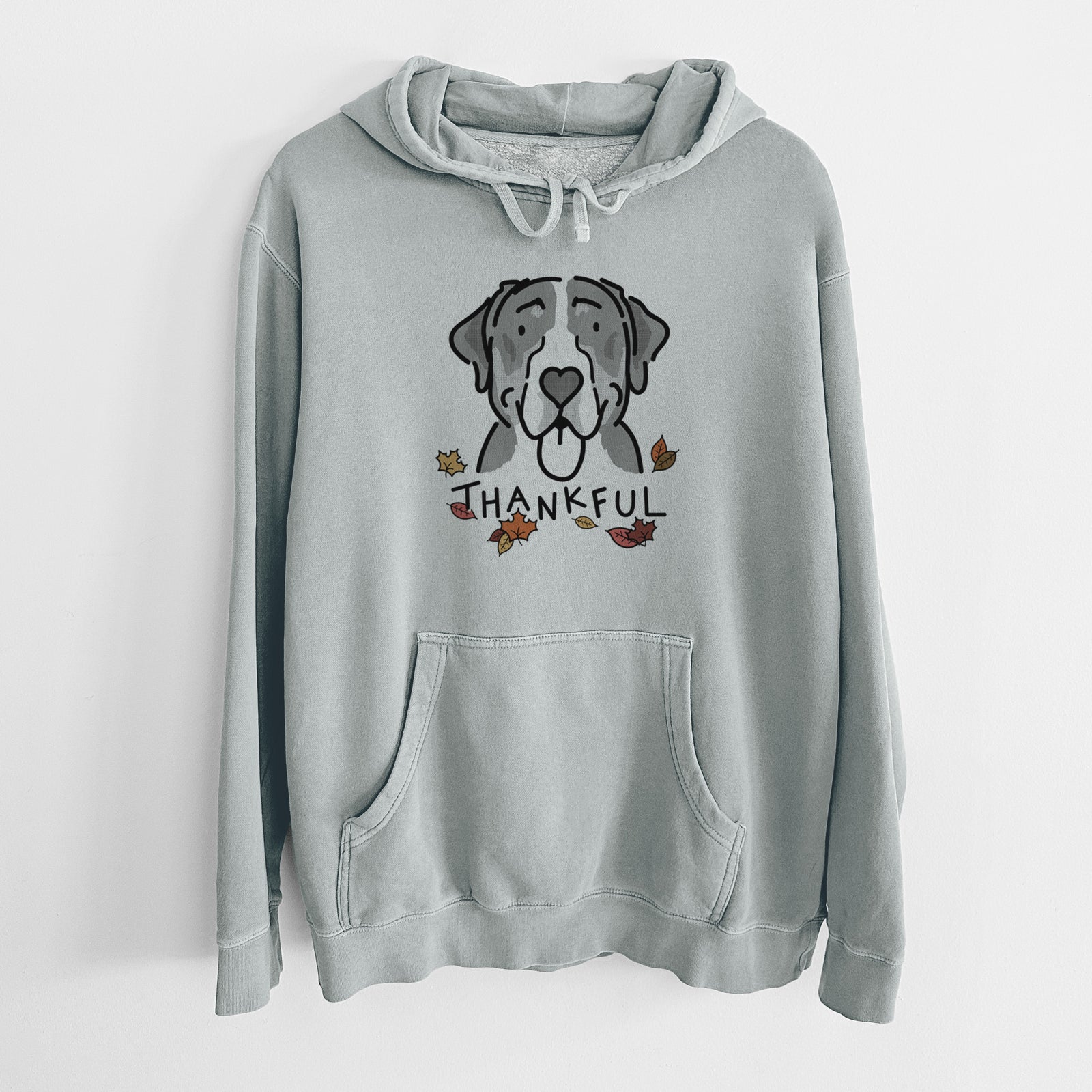Minimalist line drawing of Moose the Greater Swiss Mountain Dog with 'Thankful' lettering on a Sage Unisex pigment dyed hoodie