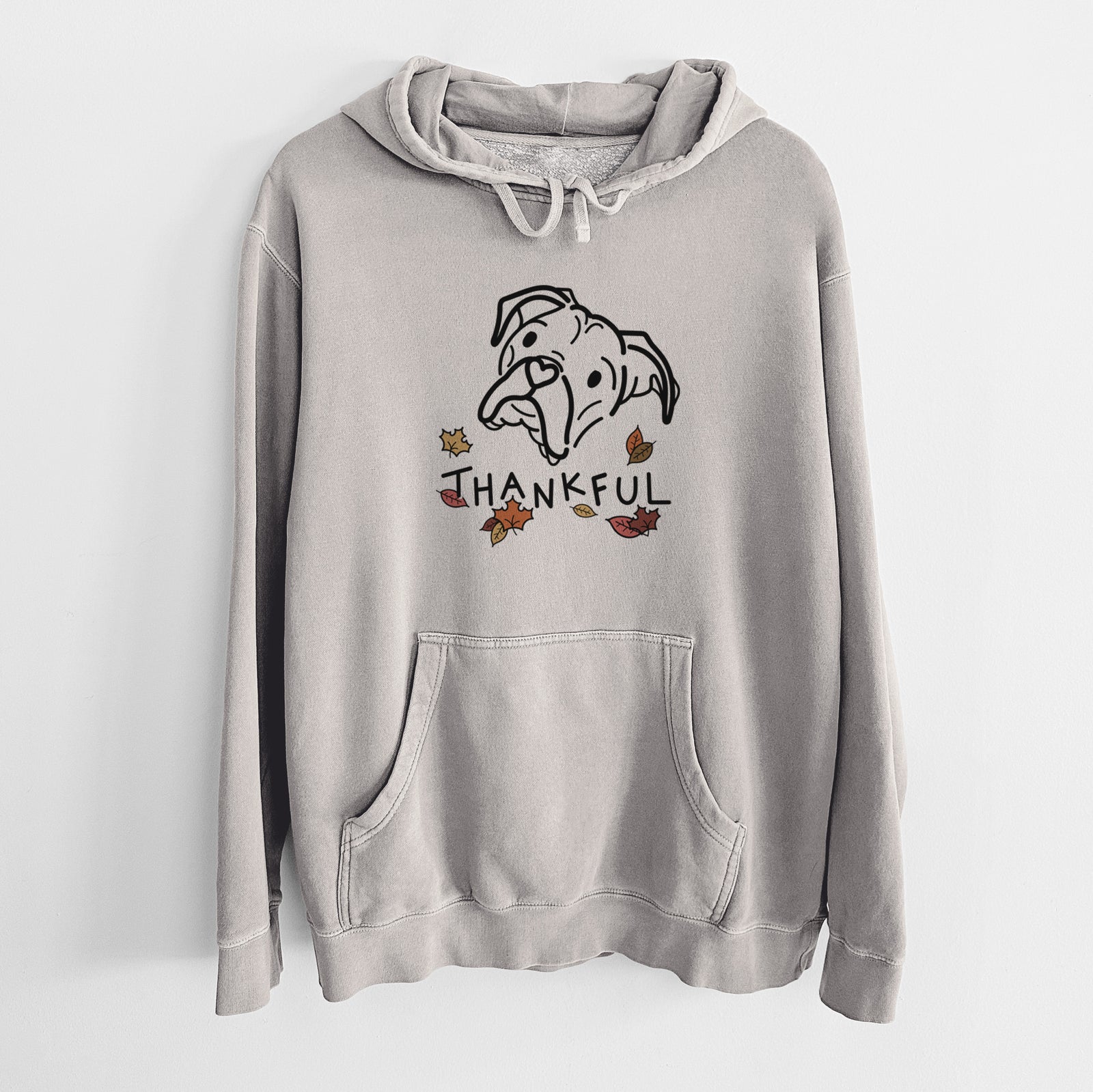 Minimalist line drawing of Noodle the Boxer with 'Thankful' lettering on a Cement Unisex pigment dyed hoodie