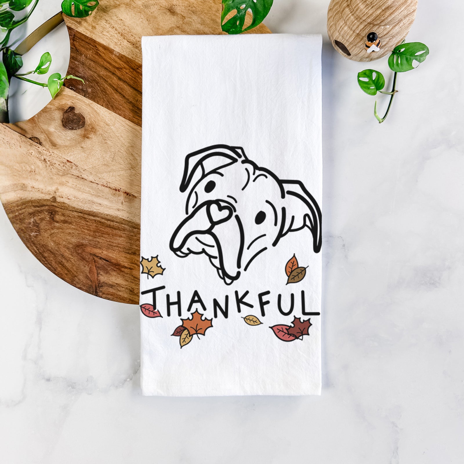 Minimalist line drawing of Noodle the Boxer with 'Thankful' lettering on a tea towel