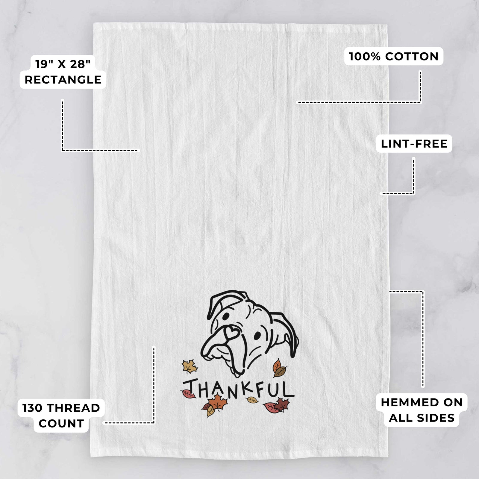 Minimalist line drawing of Noodle the Boxer with 'Thankful' lettering on a tea towel, with feature callouts: 19 x 28 inch rectangle, 100% cotton, lint-free, 120 thread count, hemmed on all sides