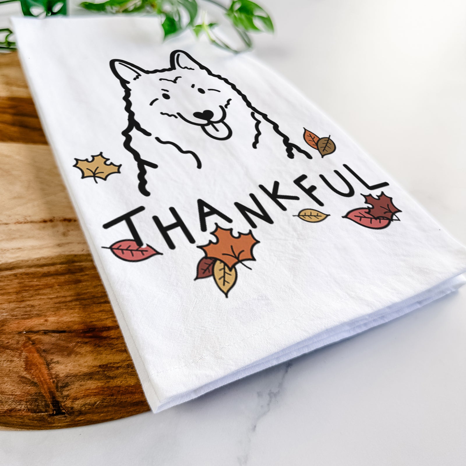 Minimalist line drawing of a Norwegian Elkhound with 'Thankful' lettering on a tea towel
