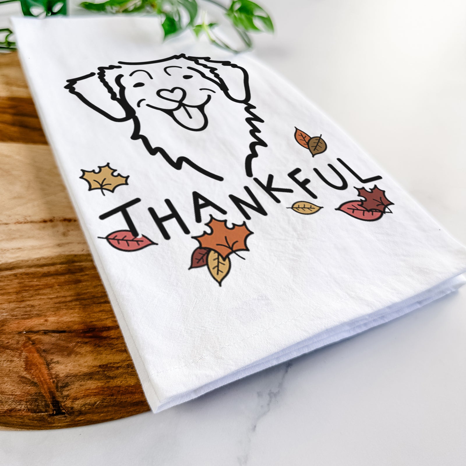 Minimalist line drawing of a Nova Scotia Duck Tolling Retriever with 'Thankful' lettering on a tea towel