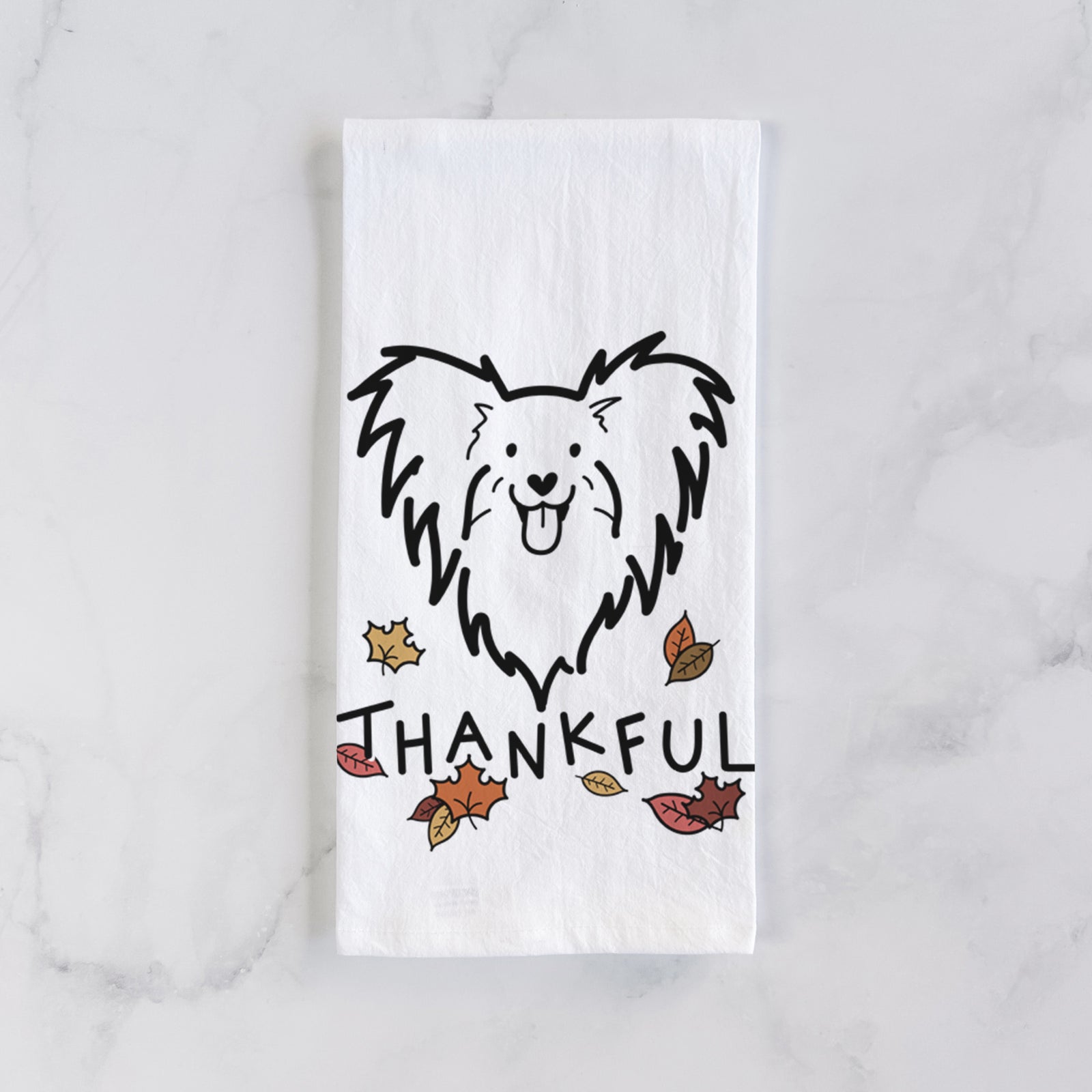 Minimalist line drawing of a Papillon with 'Thankful' lettering on a tea towel