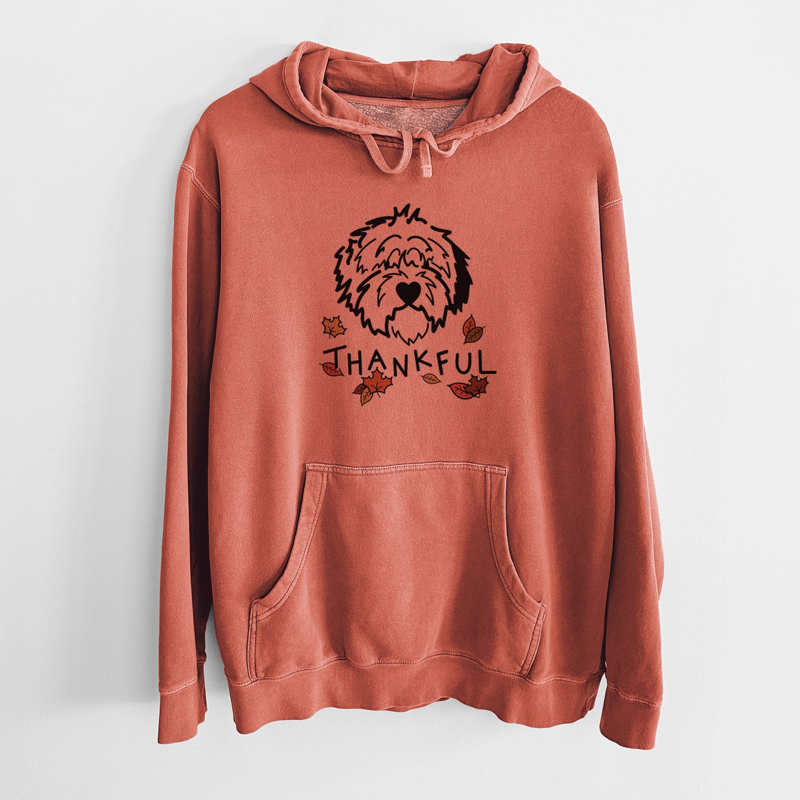 Minimalist line drawing of Penny the Old English Sheepdog with 'Thankful' lettering on an Amber Unisex pigment dyed hoodie