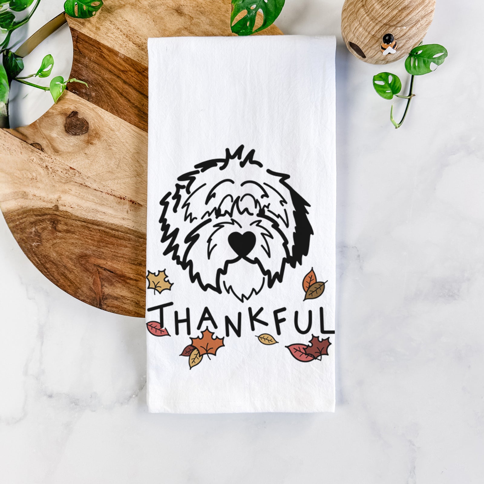 Minimalist line drawing of Penny the Old English Sheepdog with 'Thankful' lettering on a tea towel