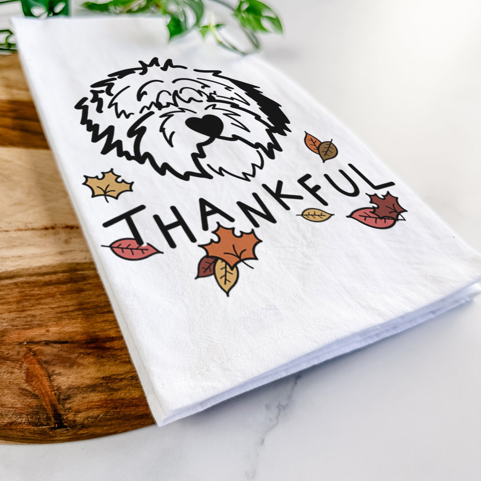 Minimalist line drawing of Penny the Old English Sheepdog with 'Thankful' lettering on a tea towel
