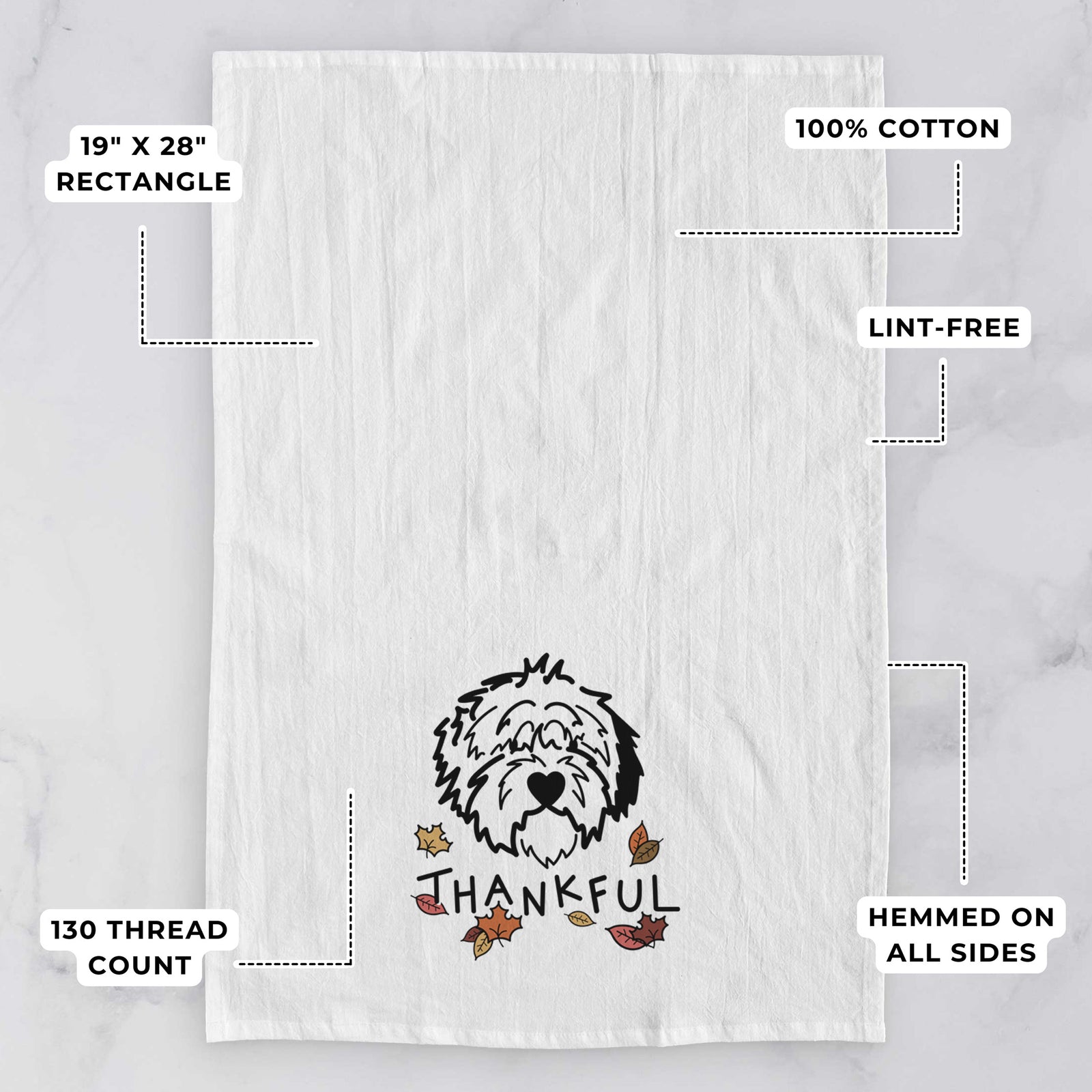 Minimalist line drawing of Penny the Old English Sheepdog with 'Thankful' lettering on a tea towel, with feature callouts: 19 x 28 inch rectangle, 100% cotton, lint-free, 120 thread count, hemmed on all sides