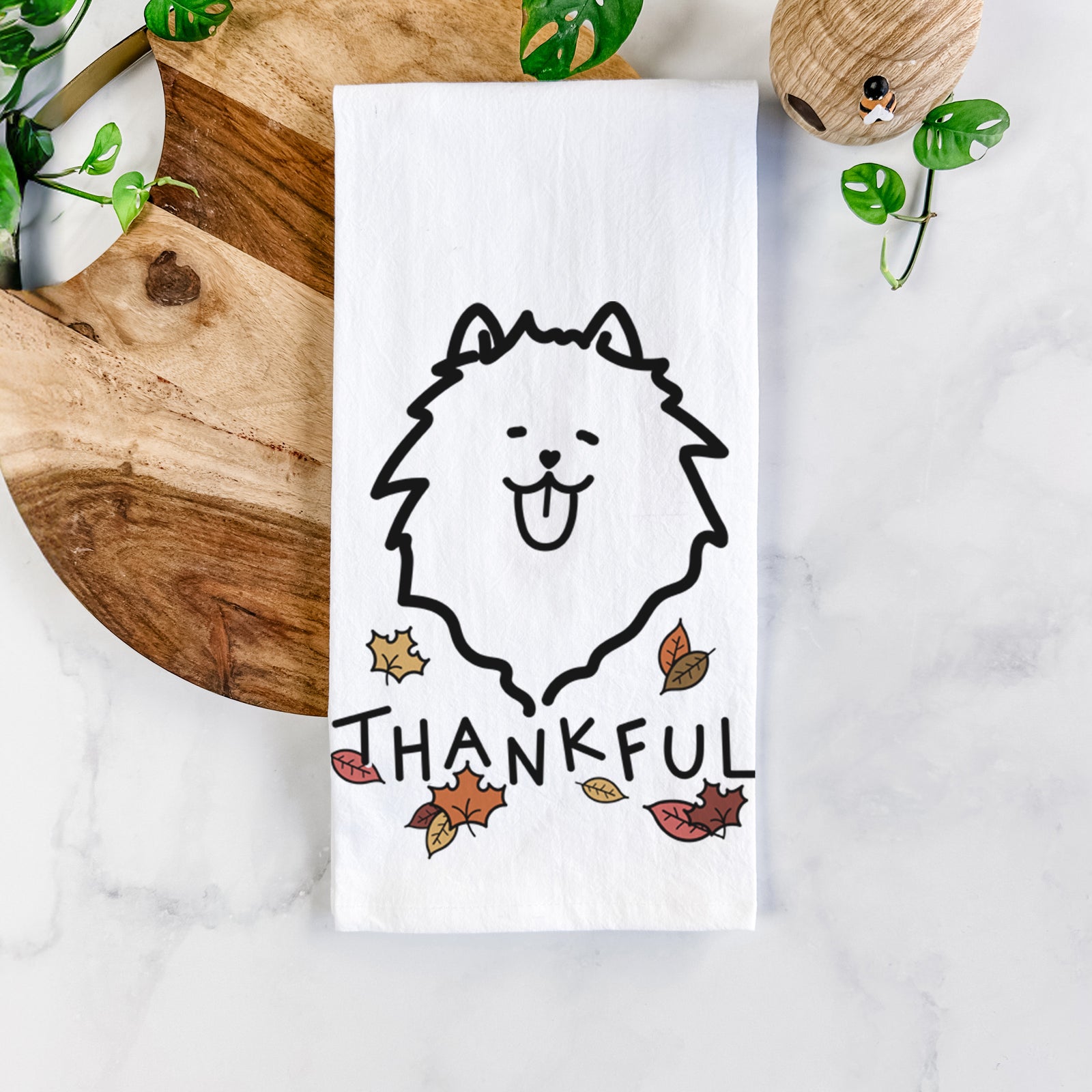 Minimalist line drawing of a Pomeranian with 'Thankful' lettering on a tea towel