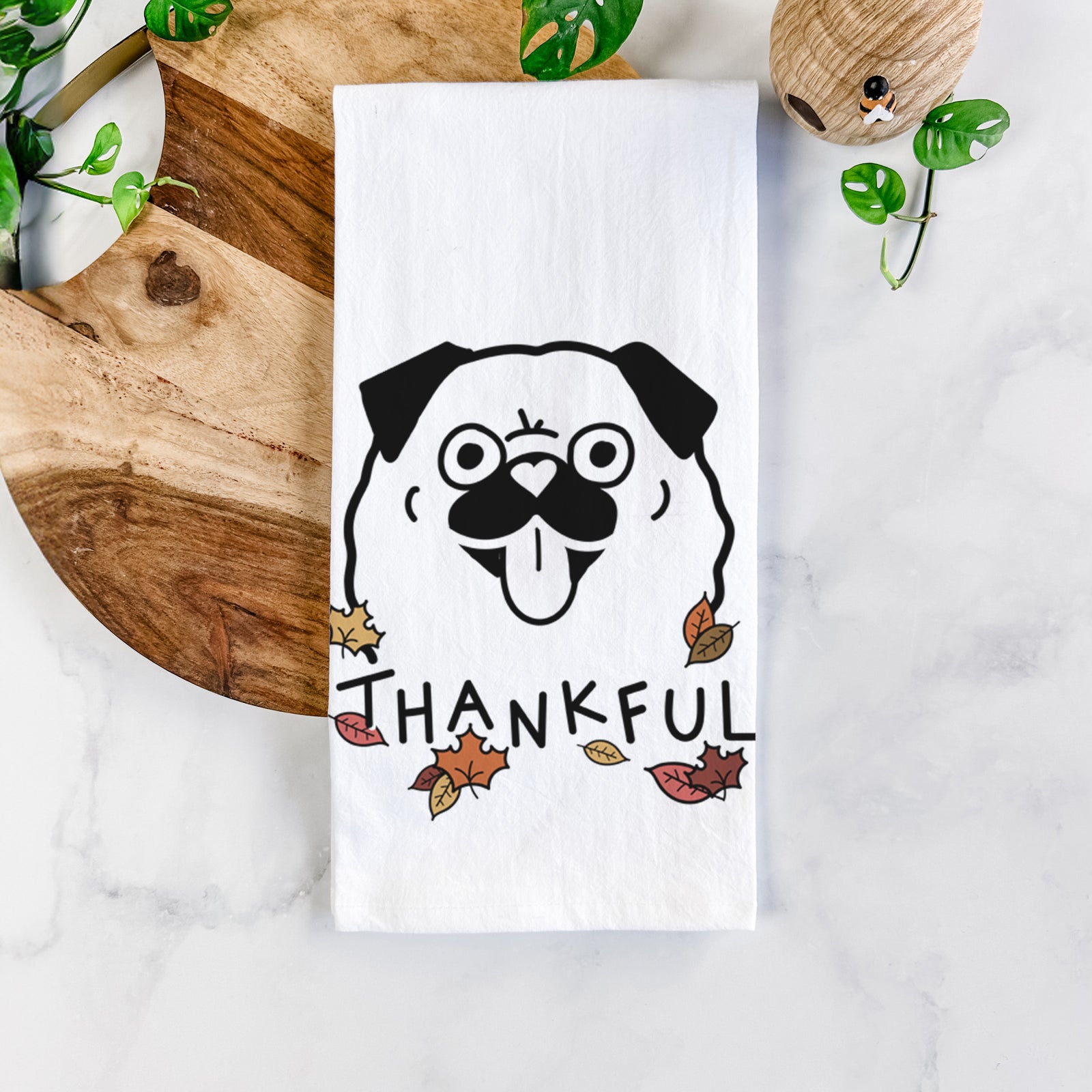 Minimalist line drawing of a Pug with 'Thankful' lettering on a tea towel