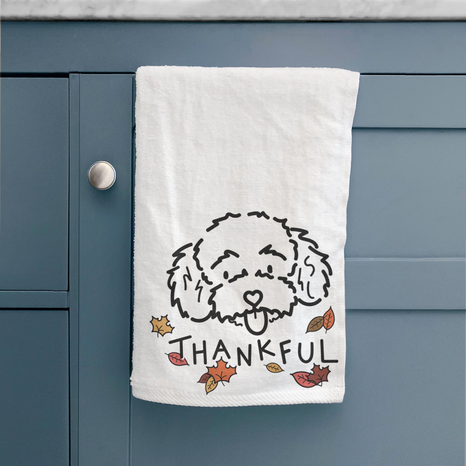 Minimalist line drawing of Ricci the Toy Poodle with 'Thankful' lettering on a hand towel