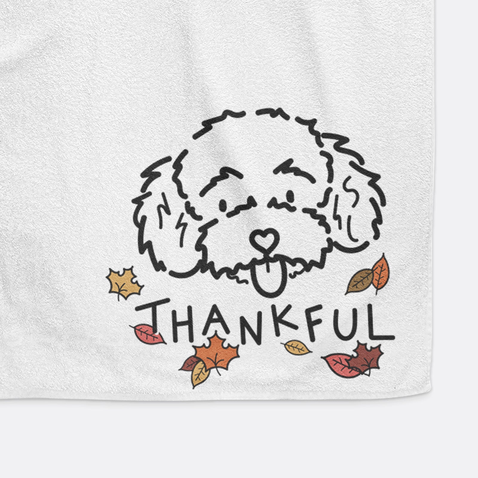 Minimalist line drawing of Ricci the Toy Poodle with 'Thankful' lettering on a hand towel