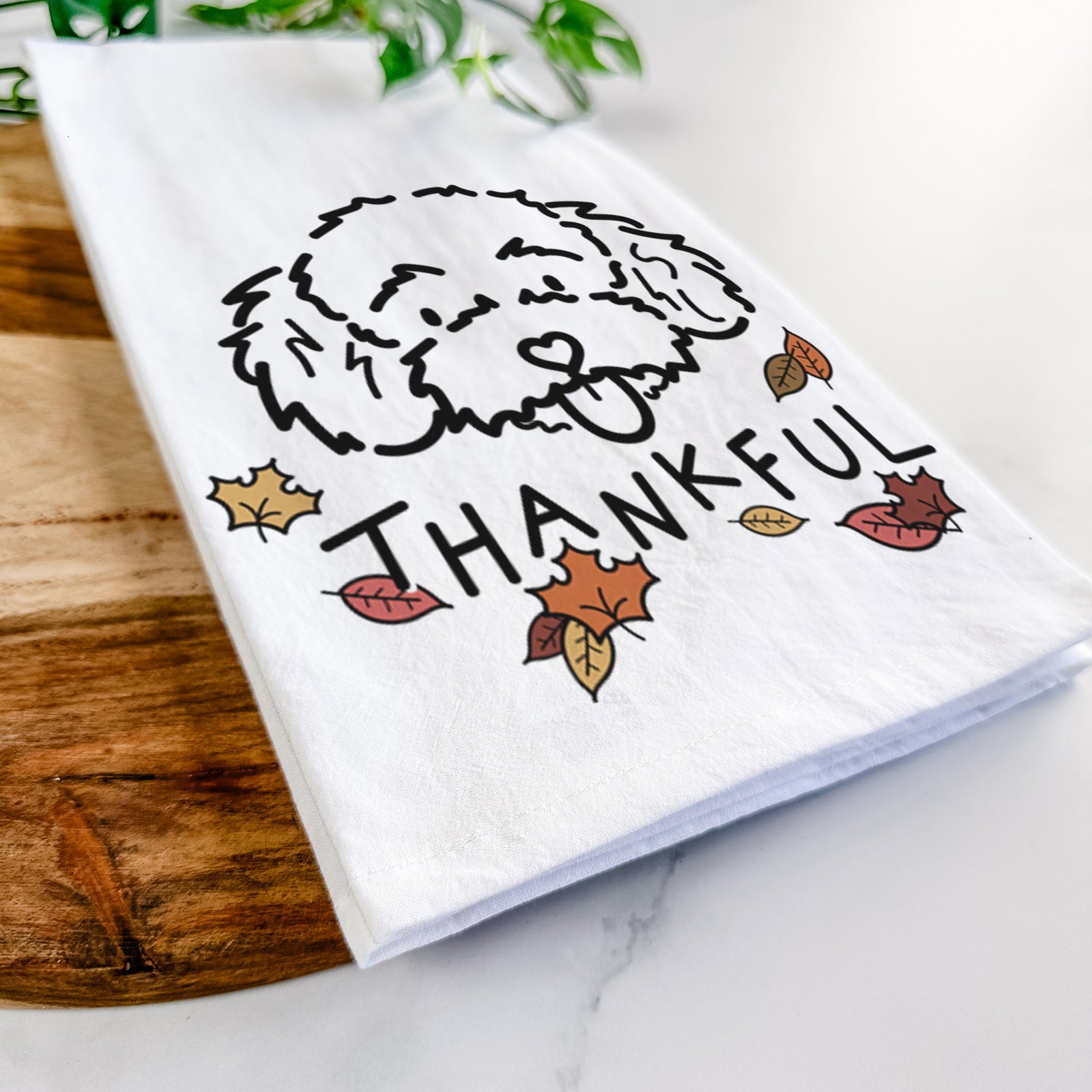 Minimalist line drawing of Ricci the Toy Poodle with 'Thankful' lettering on a tea towel