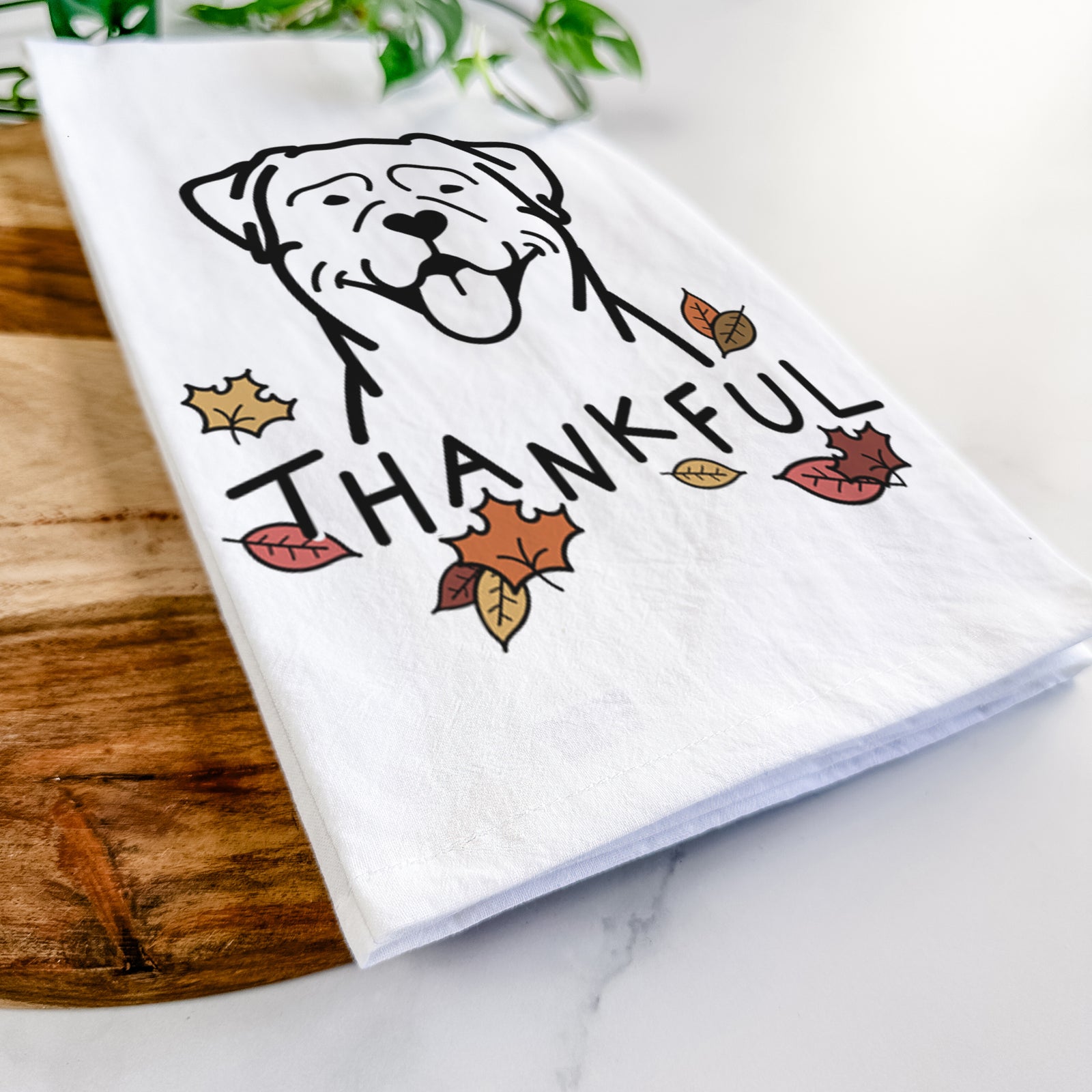 Minimalist line drawing of a Rottweiler with 'Thankful' lettering on a tea towel