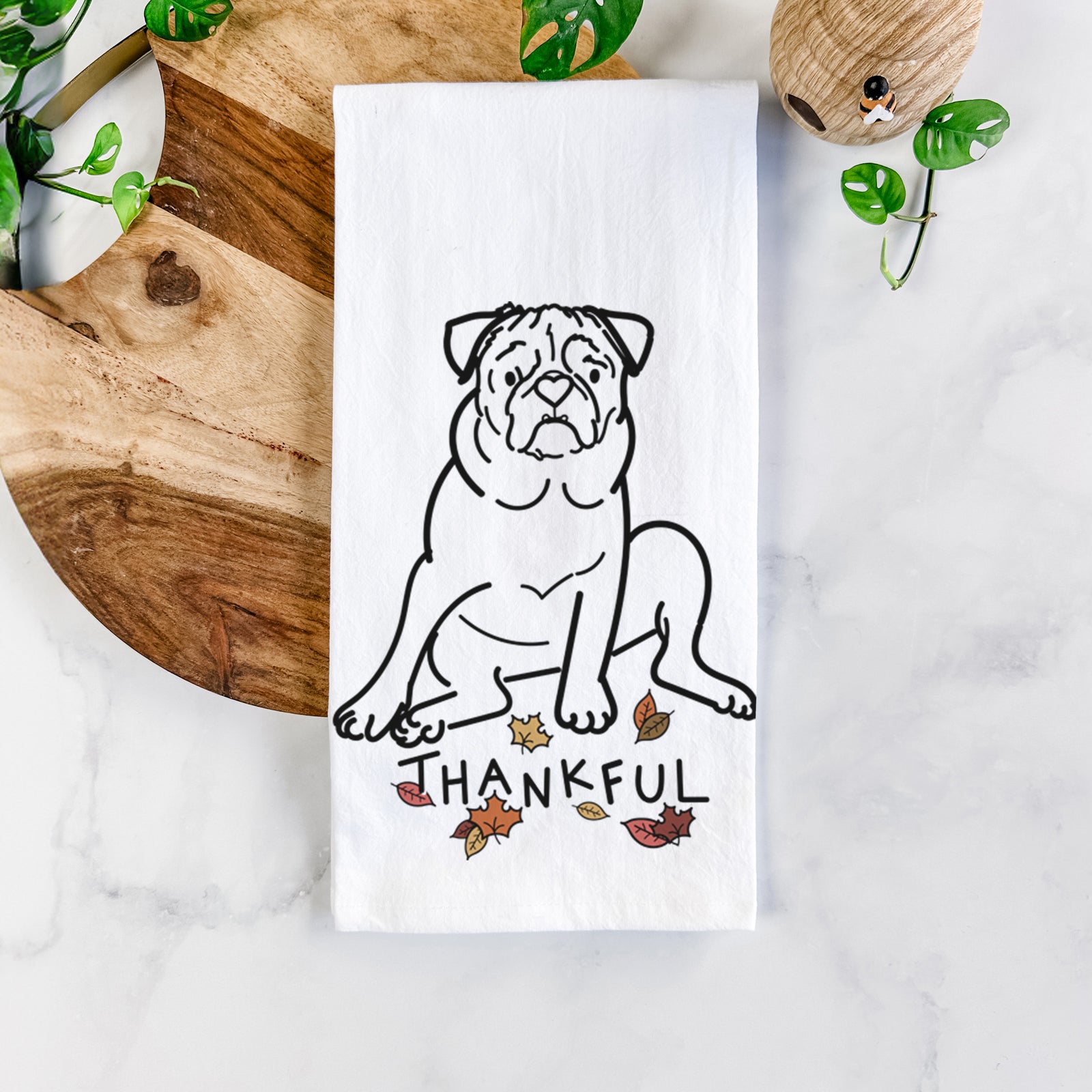 Minimalist line drawing of Rudy the Pug with 'Thankful' lettering on a tea towel