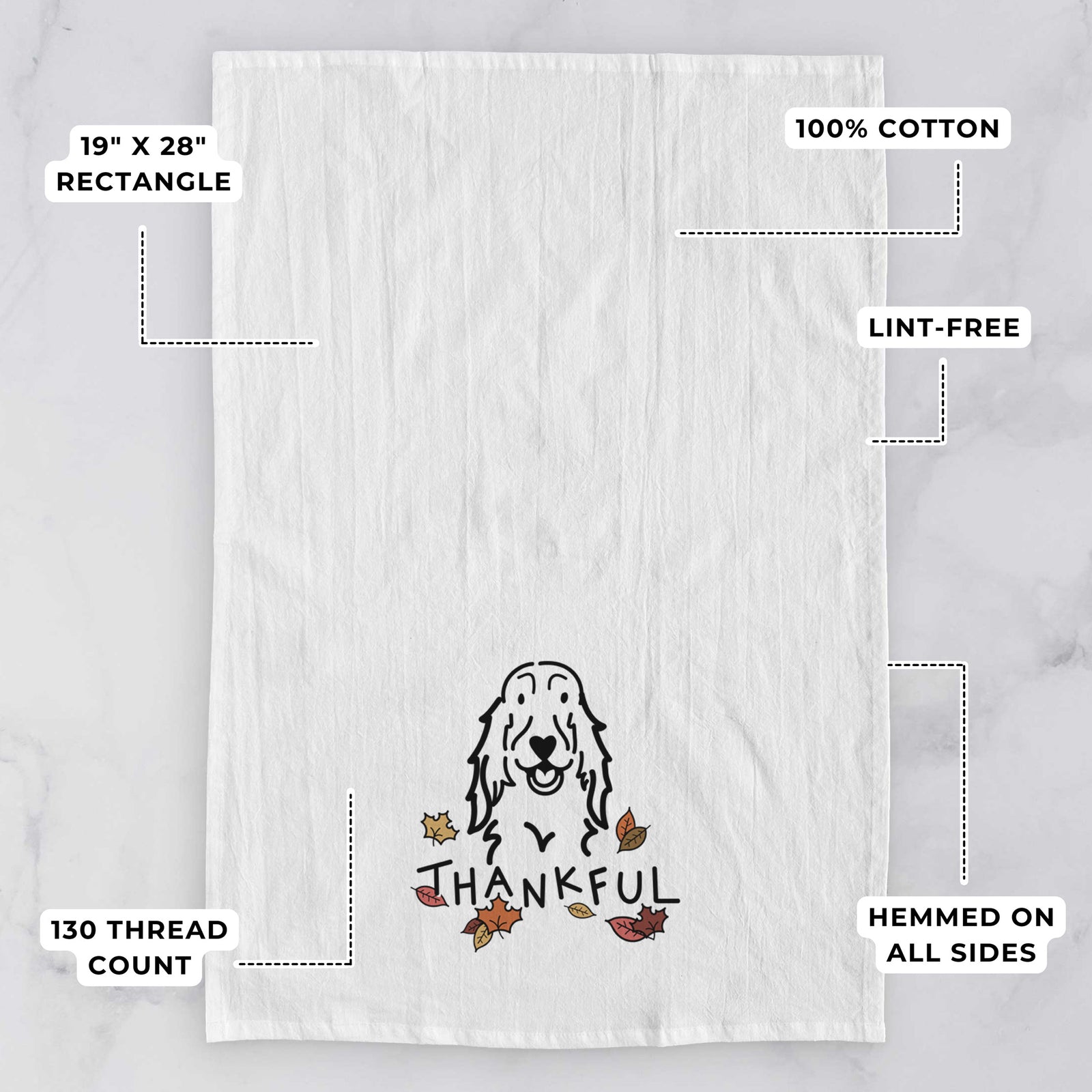 Minimalist line drawing of a Setter with 'Thankful' lettering on a tea towel, with feature callouts: 19 x 28 inch rectangle, 100% cotton, lint-free, 120 thread count, hemmed on all sides