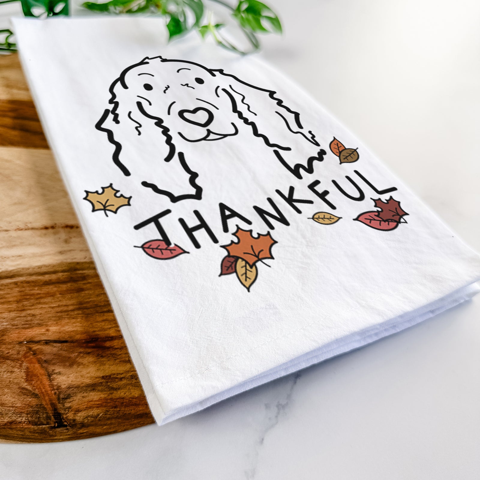 Minimalist line drawing of Seven the Irish Setter with 'Thankful' lettering on a tea towel