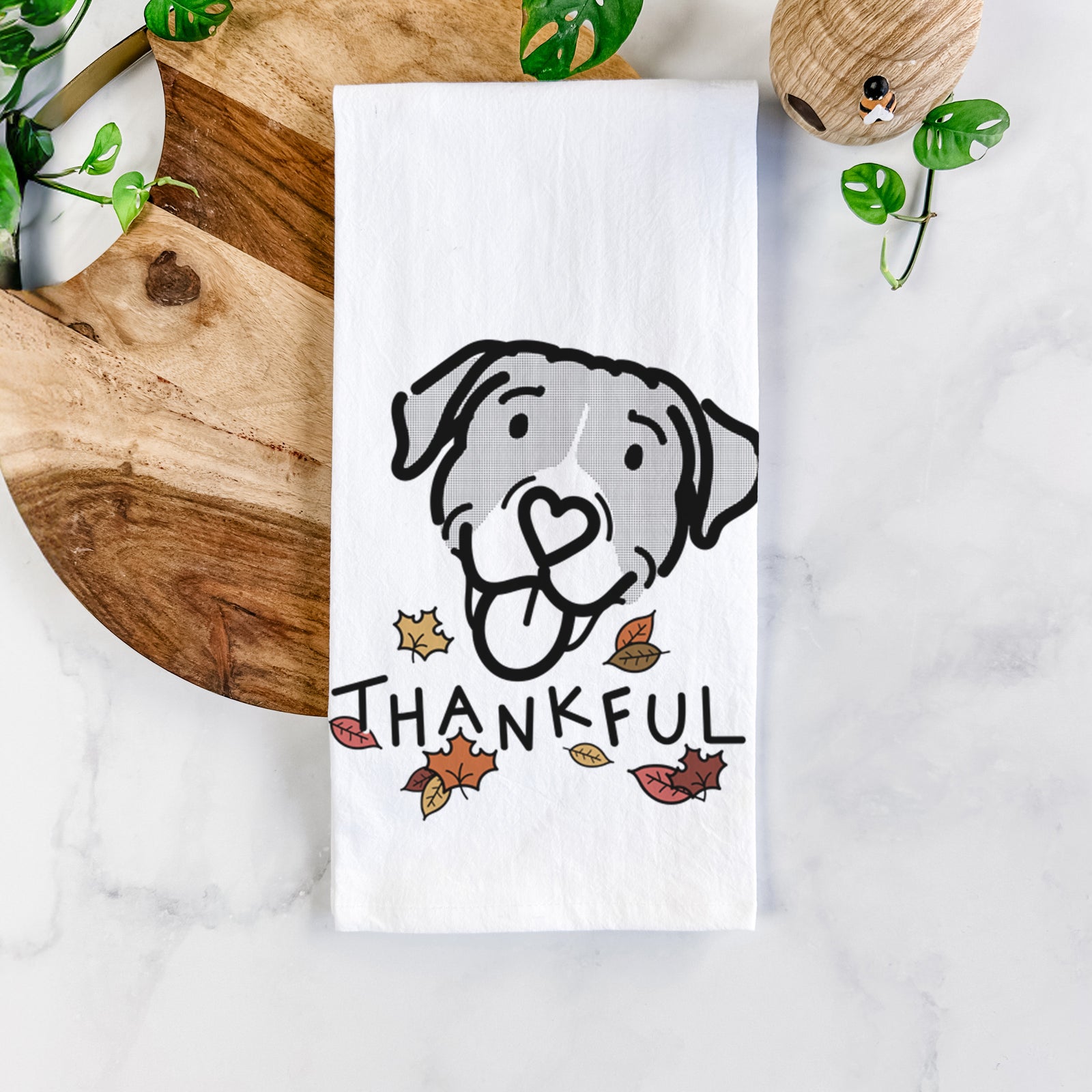 Minimalist line drawing of Shadow the Pitbull Mix with 'Thankful' lettering on a tea towel
