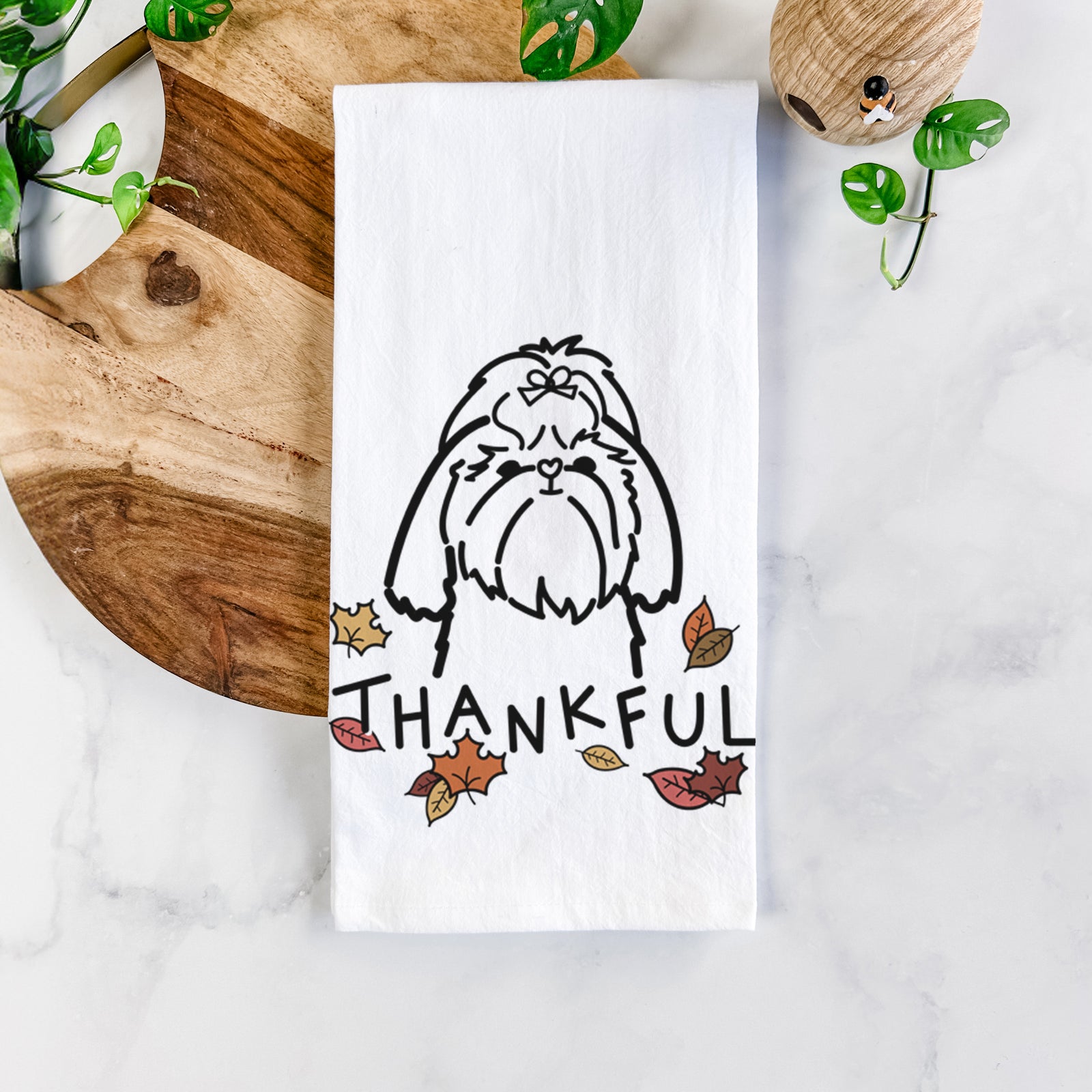 Minimalist line drawing of a Shih Tzu with 'Thankful' lettering on a tea towel