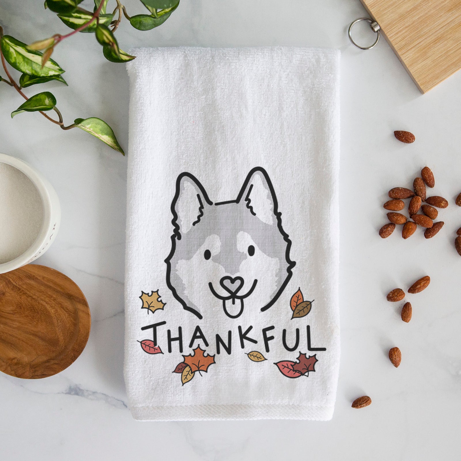 Minimalist line drawing of Sitka the Alaskan Klee Kai with 'Thankful' lettering on a decorative hand towel