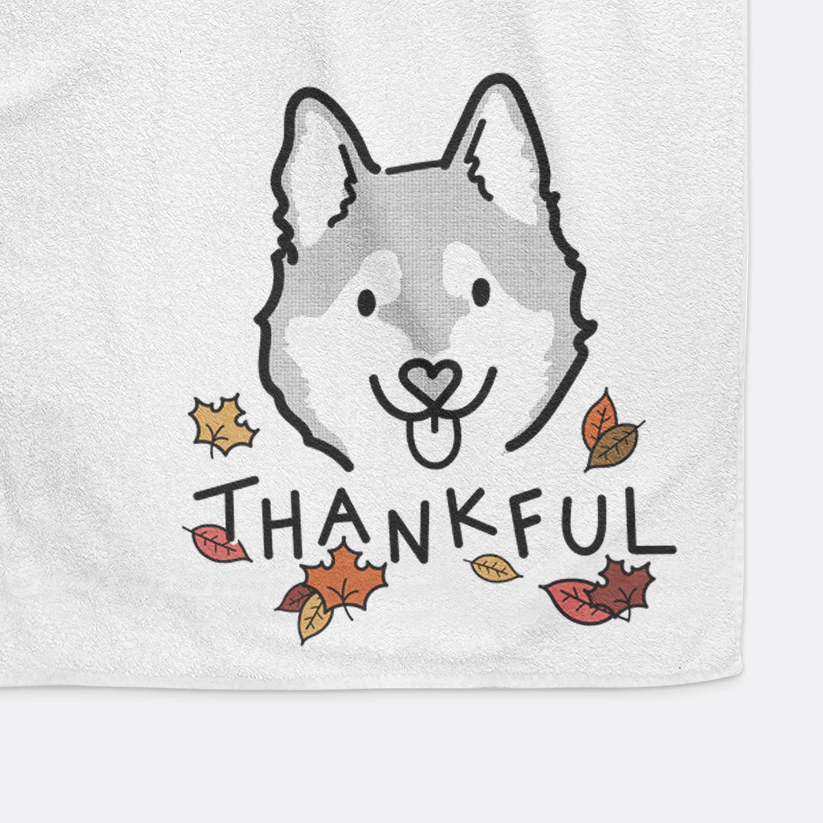 Minimalist line drawing of Sitka the Alaskan Klee Kai with 'Thankful' lettering on a decorative hand towel