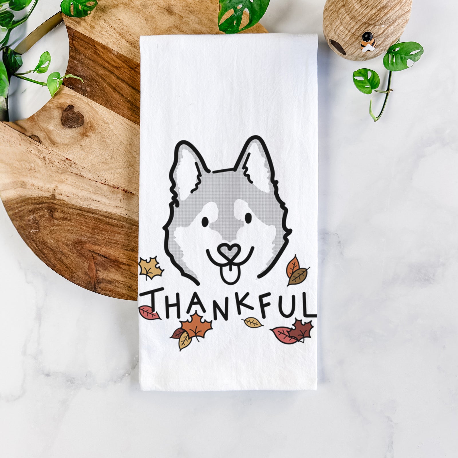 Minimalist line drawing of Sitka the Alaskan Klee Kai with 'Thankful' lettering on a tea towel