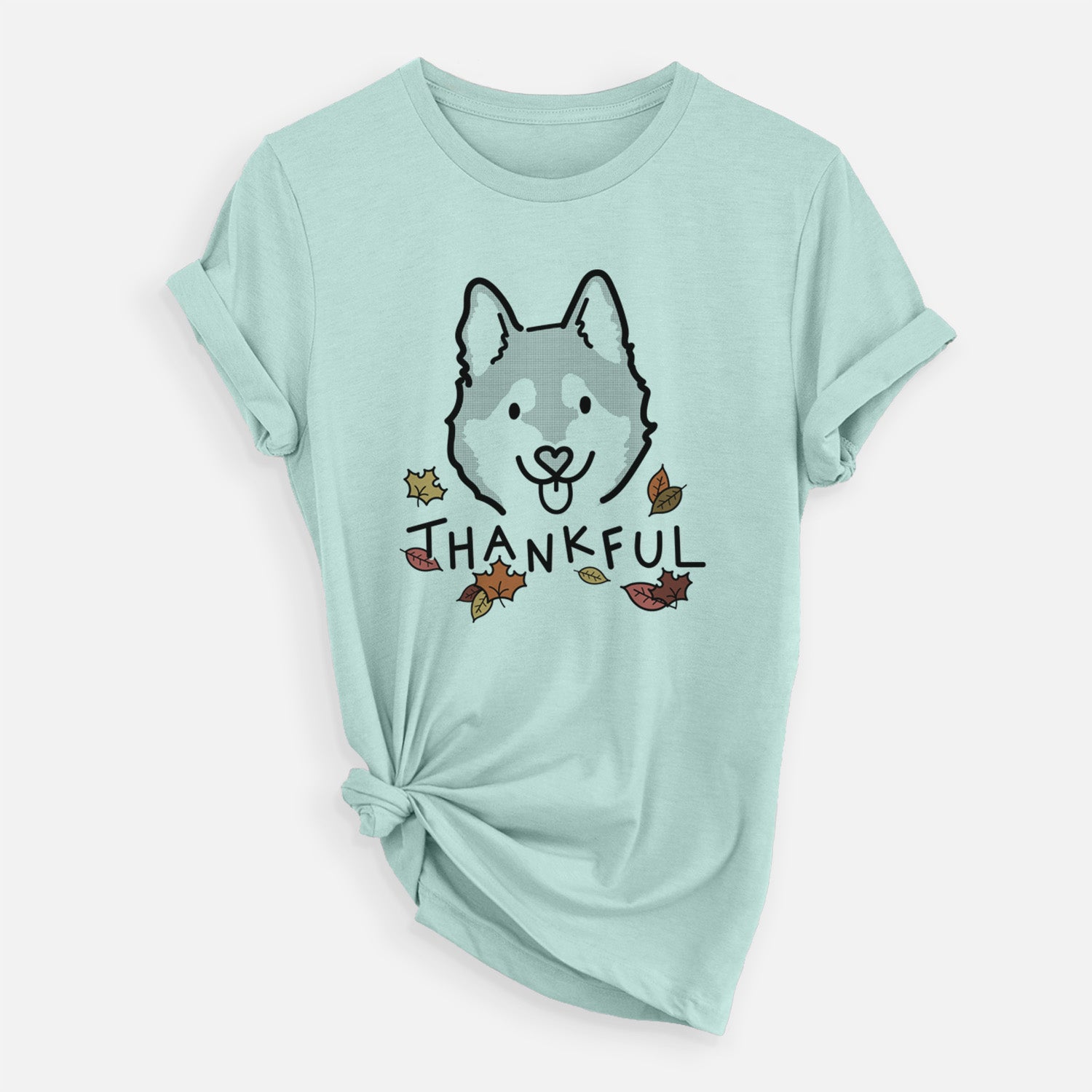 Minimalist line drawing of Sitka the Alaskan Klee Kai with 'Thankful' lettering on a Heather Sage Unisex crewneck