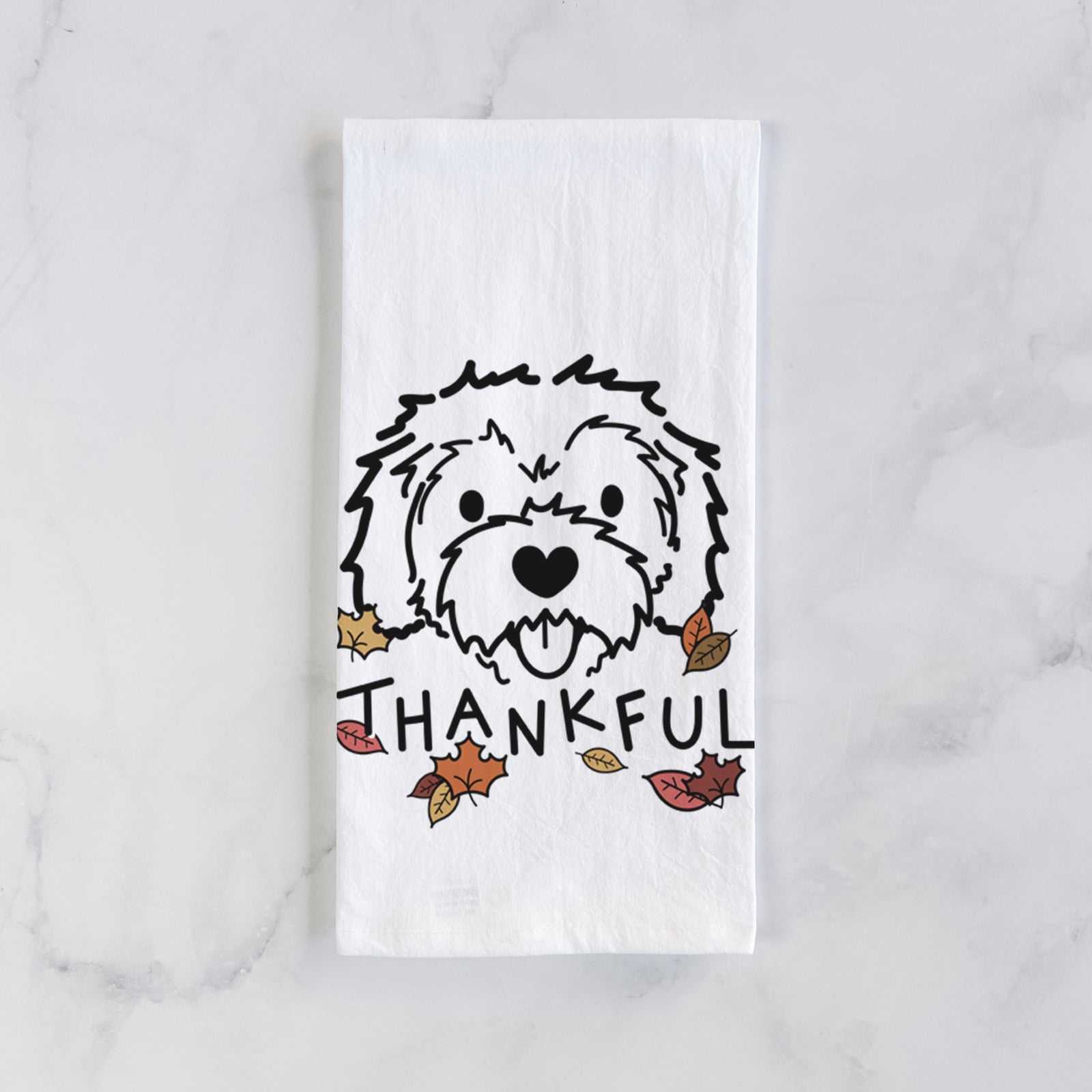 Minimalist line drawing of Sprinkles the Cockapoo with 'Thankful' lettering on a tea towel