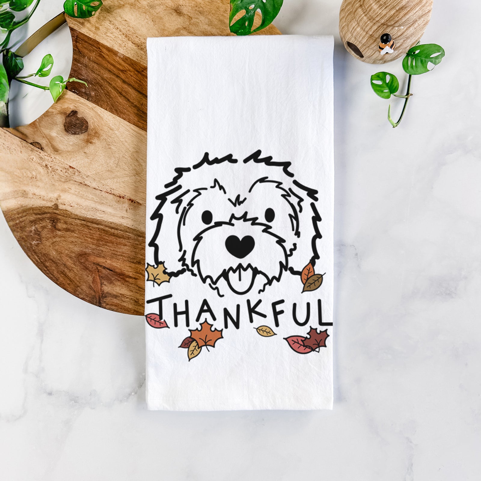 Minimalist line drawing of Sprinkles the Cockapoo with 'Thankful' lettering on a tea towel