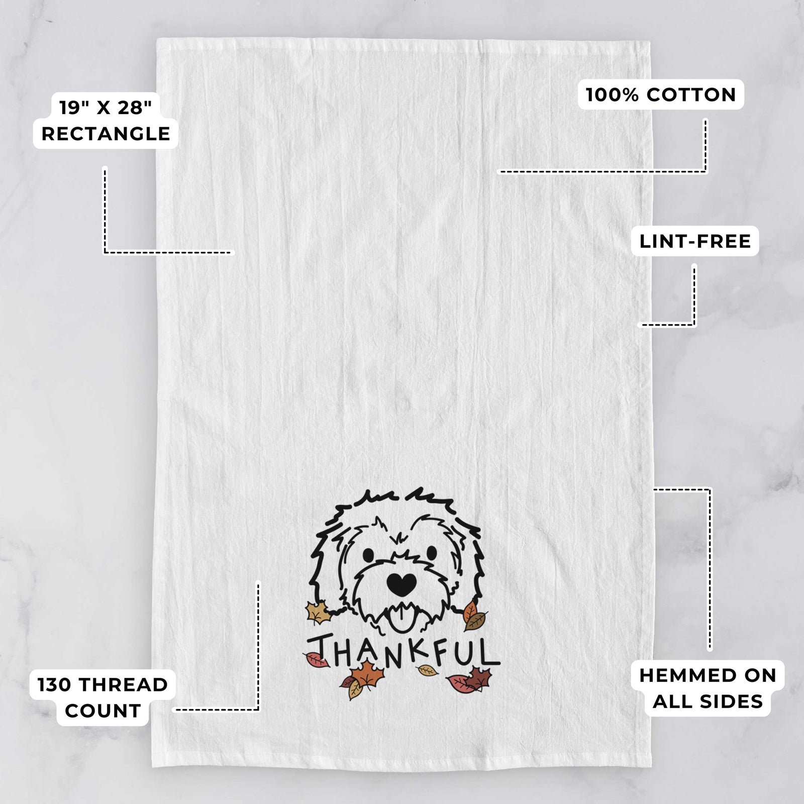 Minimalist line drawing of Sprinkles the Cockapoo with 'Thankful' lettering on a tea towel, with feature callouts: 19 x 28 inch rectangle, 100% cotton, lint-free, 120 thread count, hemmed on all sides