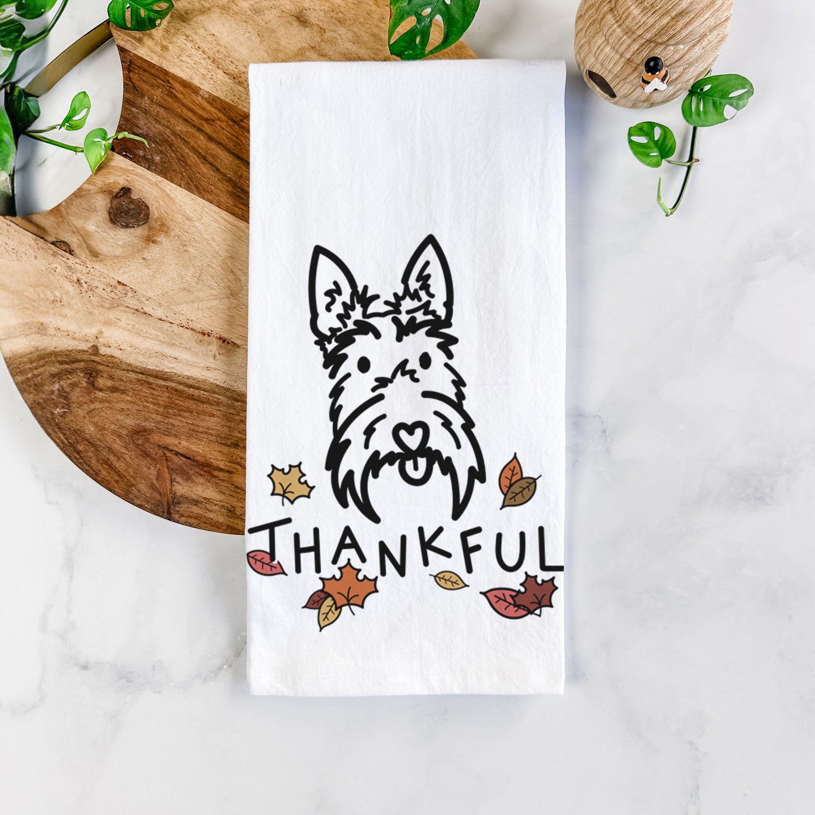 Minimalist line drawing of Thistle the Scottish Terrier with 'Thankful' lettering on a tea towel