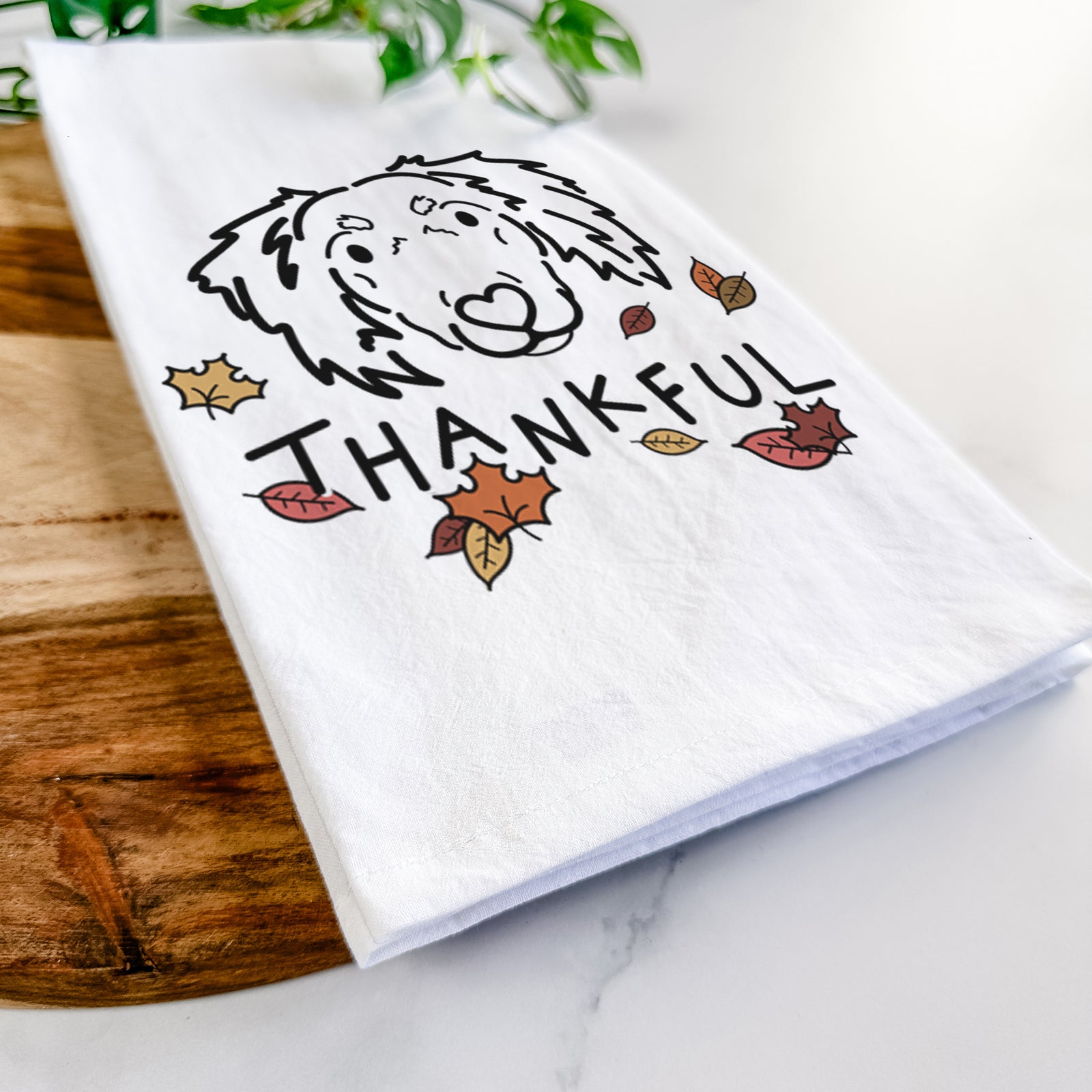 Minimalist line drawing of Tilly the Dachshund Mix with 'Thankful' lettering on a tea towel