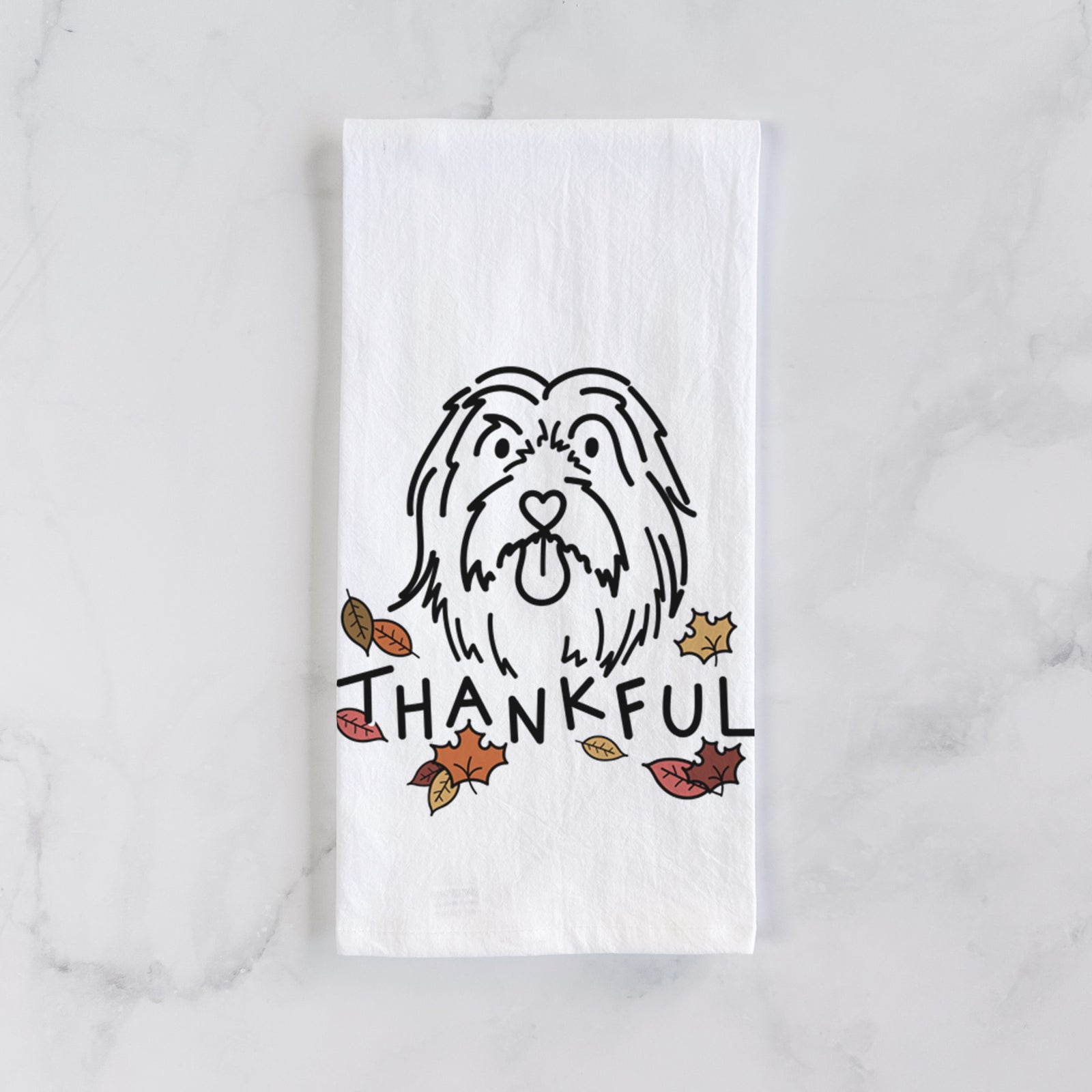 Minimalist line drawing of Tucker the Bearded Collie with 'Thankful' lettering on a tea towel
