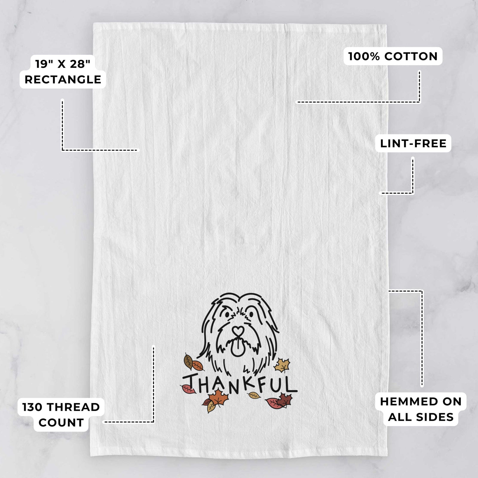 Minimalist line drawing of Tucker the Bearded Collie with 'Thankful' lettering on a tea towel, with feature callouts: 19 x 28 inch rectangle, 100% cotton, lint-free, 120 thread count, hemmed on all sides