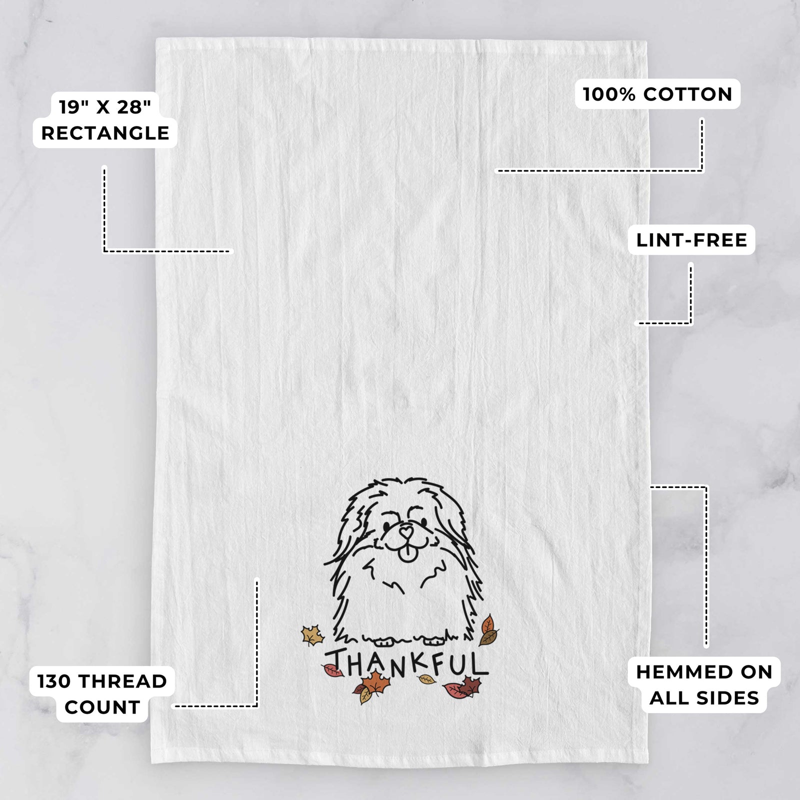 Minimalist line drawing of Viv the Pekingese with 'Thankful' lettering on a tea towel, with feature callouts: 19 x 28 inch rectangle, 100% cotton, lint-free, 120 thread count, hemmed on all sides