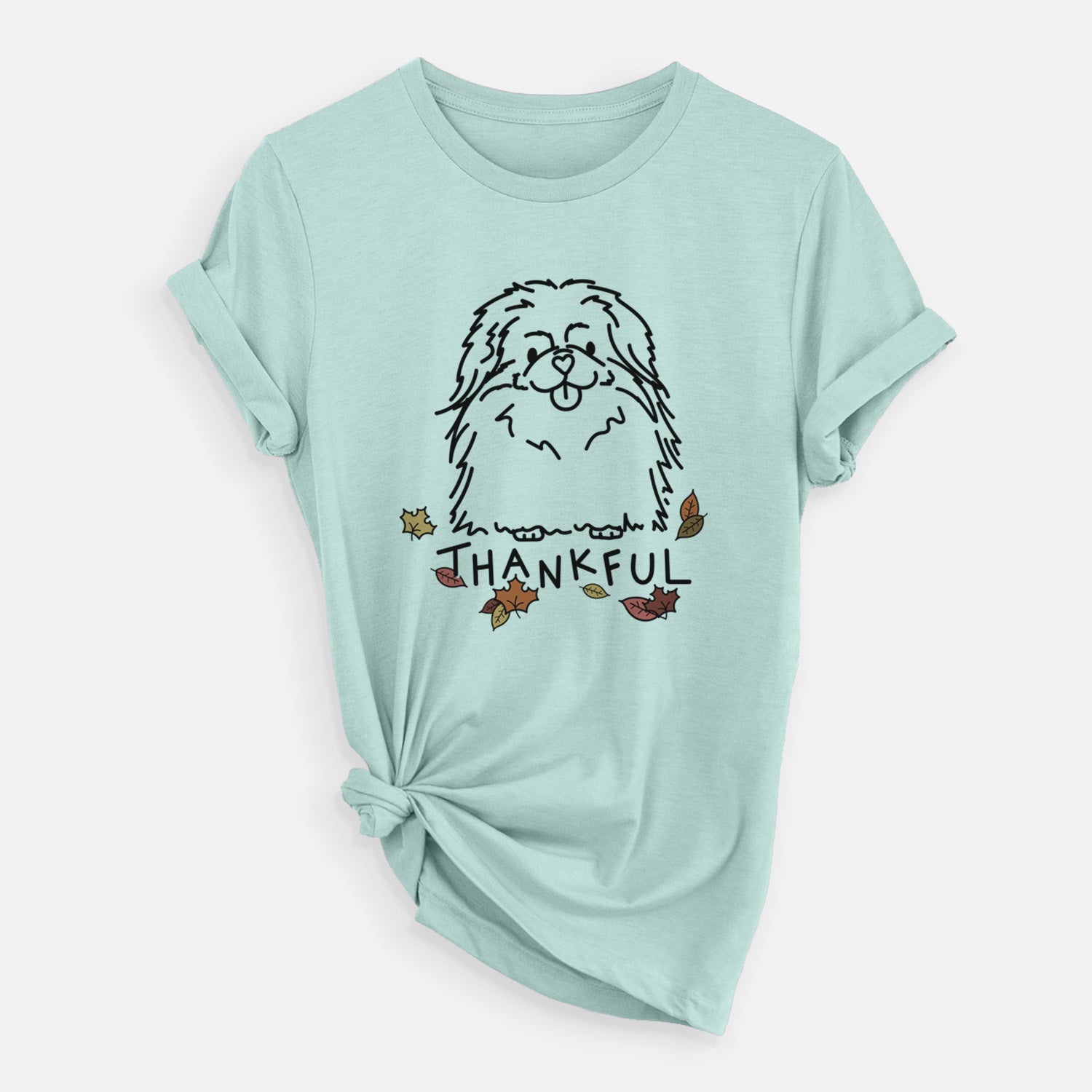 Minimalist line drawing of Viv the Pekingese with 'Thankful' lettering on a Heather Sage Unisex crewneck
